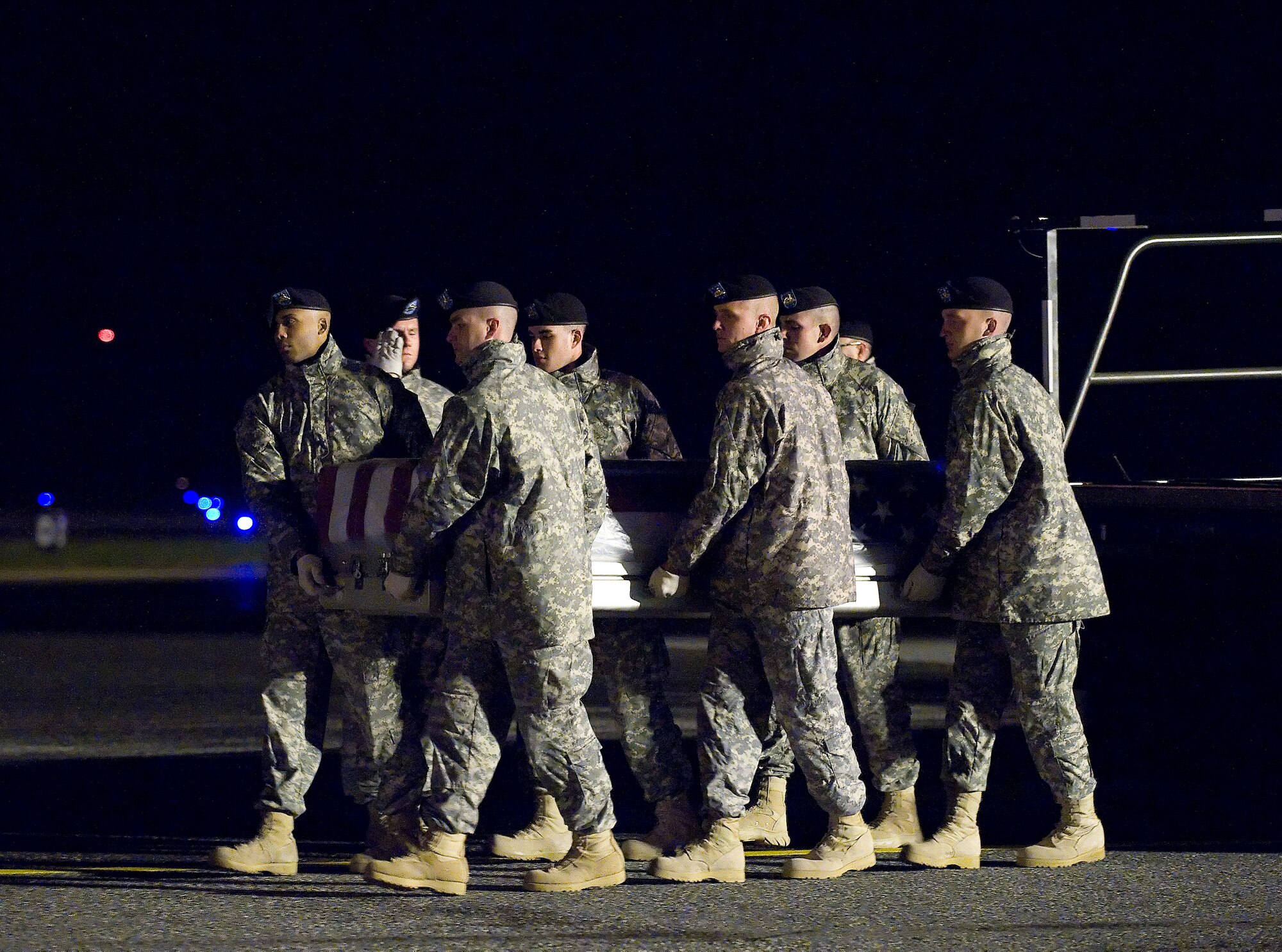 A U.S. Army carry team transfers the remains of Army Spc. James (Chad) Young of Rochester, Ill., at Dover Air Force Base, Del., Nov. 5, 2010.  He was assigned to the 863rd Engineer Battalion, Darien, Ill. (U.S. Air Force photo/Jason Minto)
