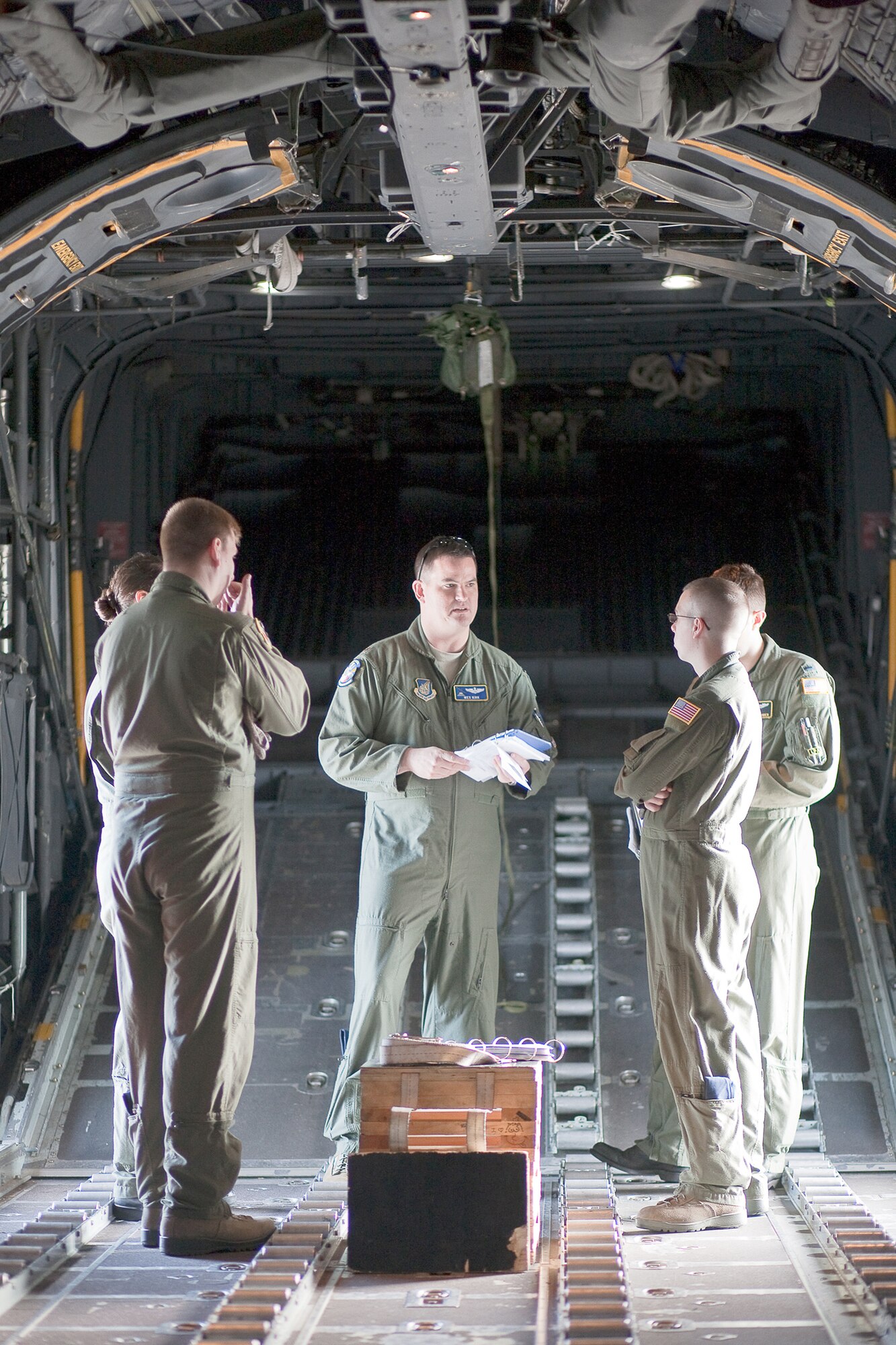 Aircrew from 36th Airlift Squadron have a meeting on a C-130 Hercules Nov. 4, 2010, at Yokota Air Base, Japan before launching as part of a seven-ship formation flight, known as a Samurai Surge. (U.S. Air Force photo/Osakabe Yasuo)