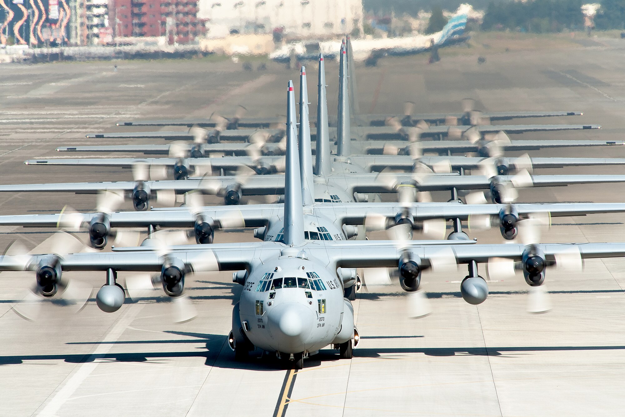 C-130 Hercules aircraft from the 36th Airlift Squadron taxi out for a mission during a seven-ship sortie Nov. 4, 2010, at Yokota Air Base, Japan. The sortie was part of a Samurai Surge exercise. The squadron is the only forward-based tactical airlift squadron in the Pacific region. They provide C-130 aircrews to conduct theater airlift, special operations, aeromedical evacuation, search and rescue, repatriation and humanitarian relief missions. (U.S. Air Force photo/Osakabe Yasuo)