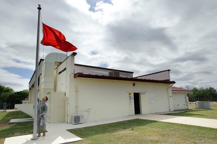 Randolph AFB, TX, 03 November 2010: Tech. Sgt. Arturo Delgado, combat arms instructor with the 902nd Security Forces Squadron, raises the range warning flag at the newly renovated firing range prior to the first M-16 A2 Air Force Qualification Course live fire training to be conducted at Randolph in two years. The reopening saves approximately 2.5 hours of traveling per firing class and alleviates scheduling conflicts and range closures at other facilities allowing the 902nd SFS the ability to conduct more effective training.(U.S. Air Force photo/Steve Thurow)