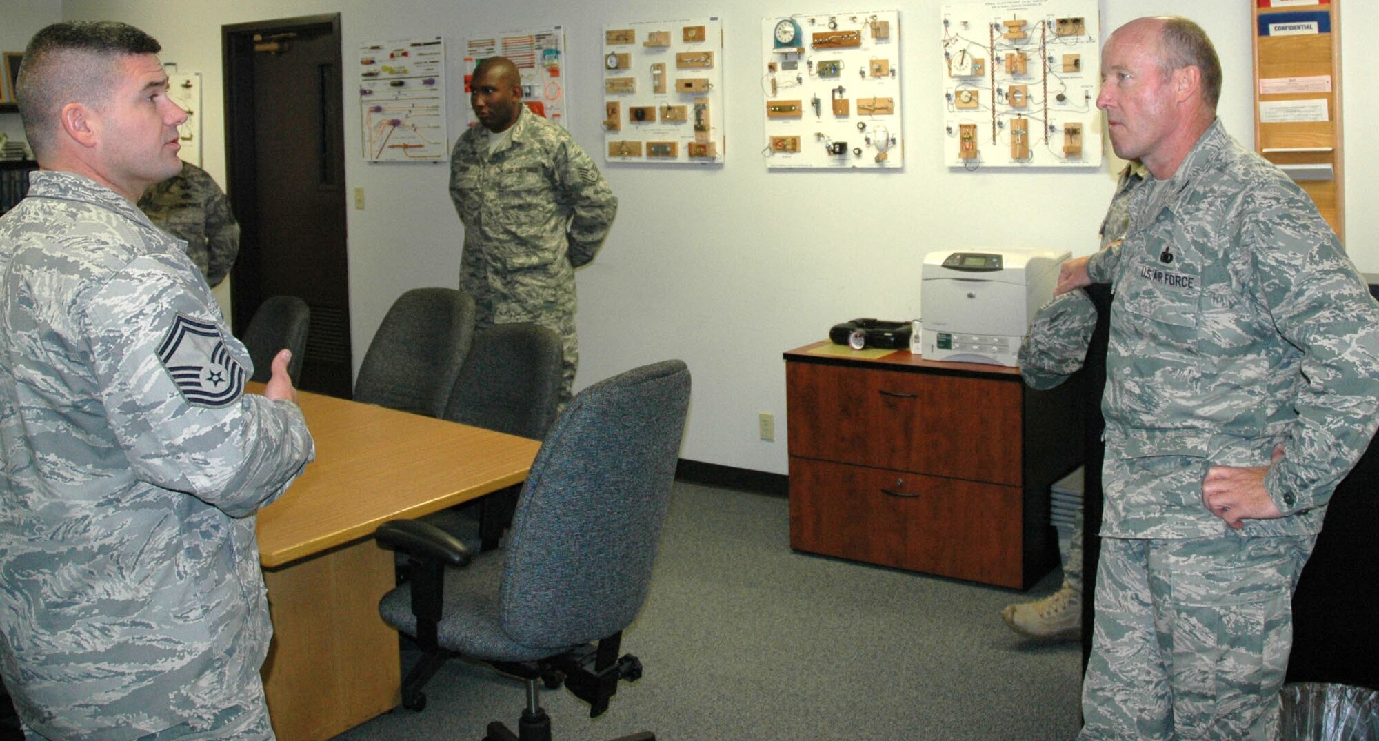 JOINT BASE LEWIS-MCCHORD, Wash.- Senior Master Sgt. Jeffrey Sursely, left, introduces Col. Gerald Vowell, right, 446th Mission Support Group commander to Reservists from the 446th Civil Engineer Squadron Explosive Ordnance Disposal Flight, such as Staff Sgt. Cornell Cruse, center, during the EOD Safety day training session Sunday of the November Reserve weekend. EOD Safety Day serves as a refresher of the best practices and procedures for the EOD team. (U.S. Air Force Photo/Staff Sgt. Javier Cruz)