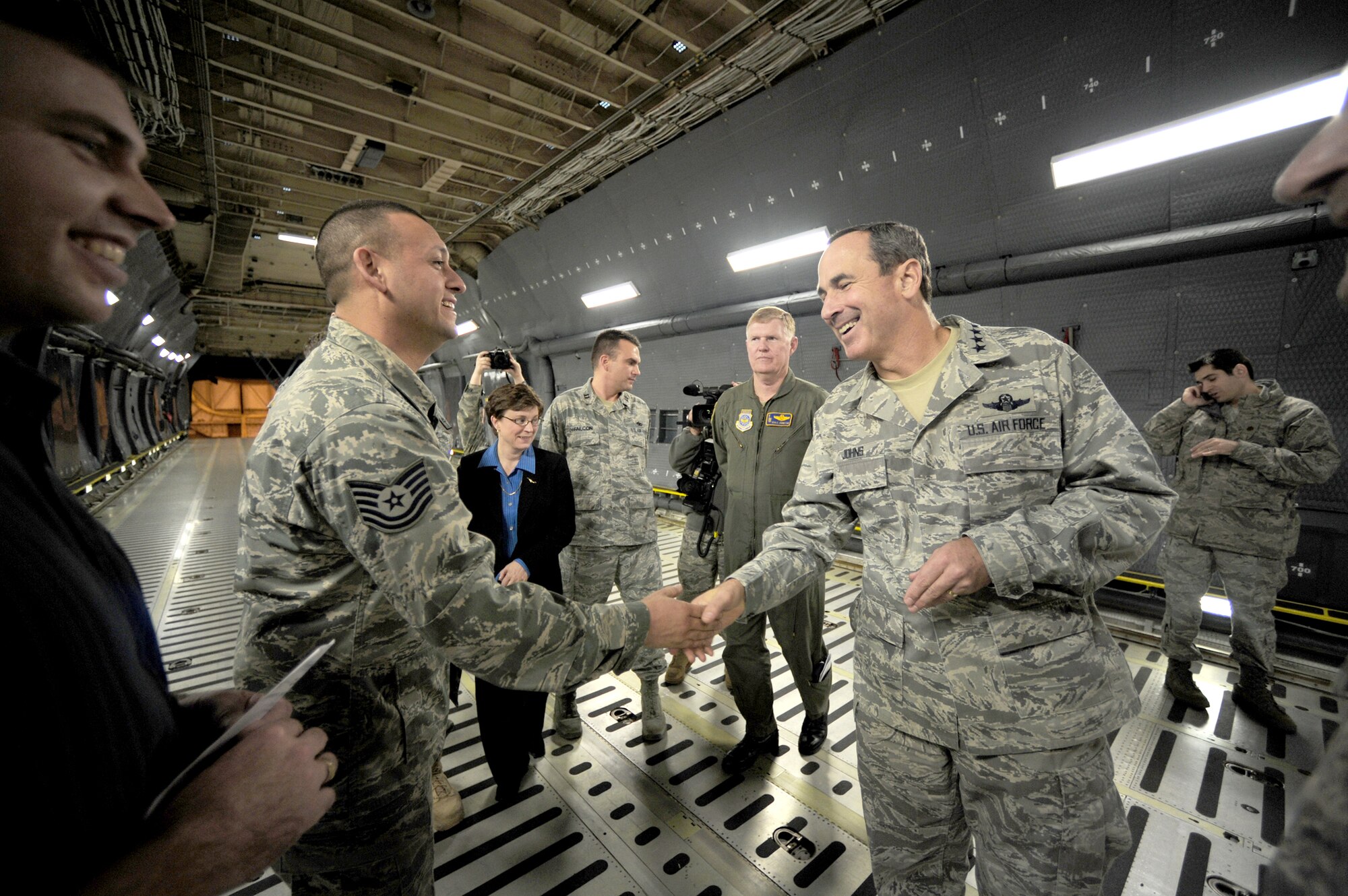 Gen. Raymond E. Johns Jr., commander of Air Mobility Command, greets members of the 105th Maintenance Squadron at Stewart Air National Guard Base, N.Y., Nov. 5, 2010, during a ceremony there to mark the completion of reconditioning of a C-5M Super Galaxy. Later, General Johns flew the C-5M to its new home at Dover Air Force Base, Del.  (U.S. Air Force photo/Tech. Sgt. DeNoris A. Mickle)