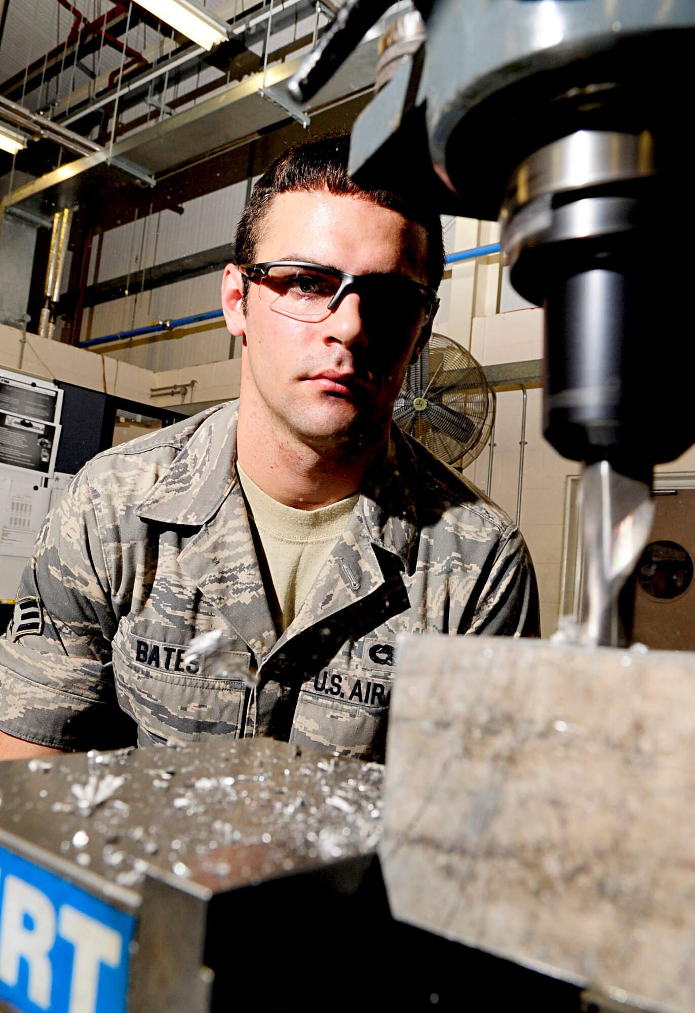 RAF MILDENHALL, England -- Senior Airman Brandon Bates, 100th Maintenance Squadron aircraft metals technology journeyman, starts cutting a bracket out of a block of metal Nov. 3, 2010. Brackets are just one of the many parts fabricated for aircraft. (U.S. Air Force photo/Senior Airman Ethan Morgan) 