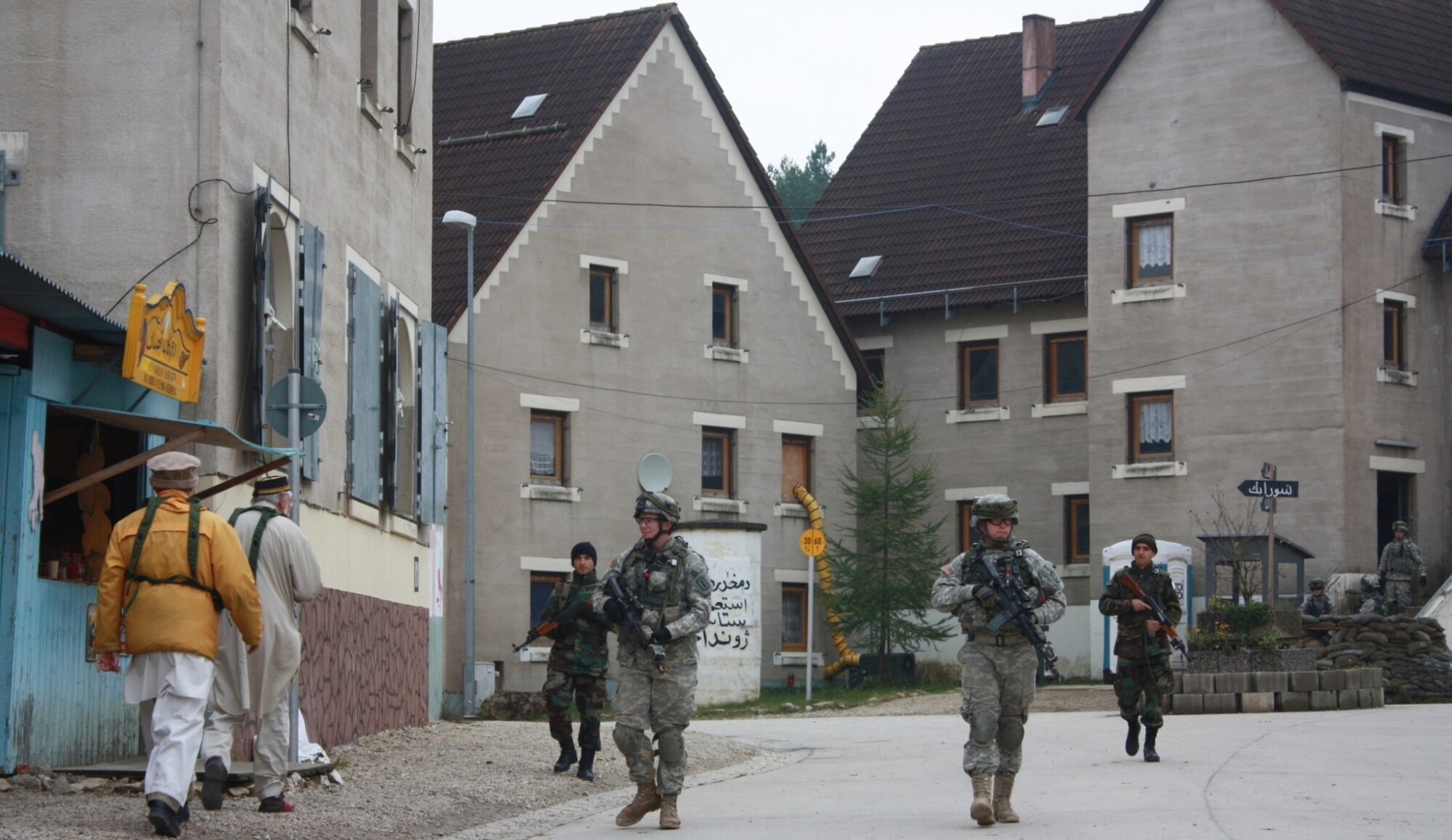 Soldiers from the 170th IBCT from Baumholder, Germany, conduct a patrol with air-ground support from the Czech Republic and Germany as they trained for their upcoming deployment to Afghanistan during a recent exercise in Hohenfels, Germany.  (Casey Bain, JFIIT, USJFCOM)