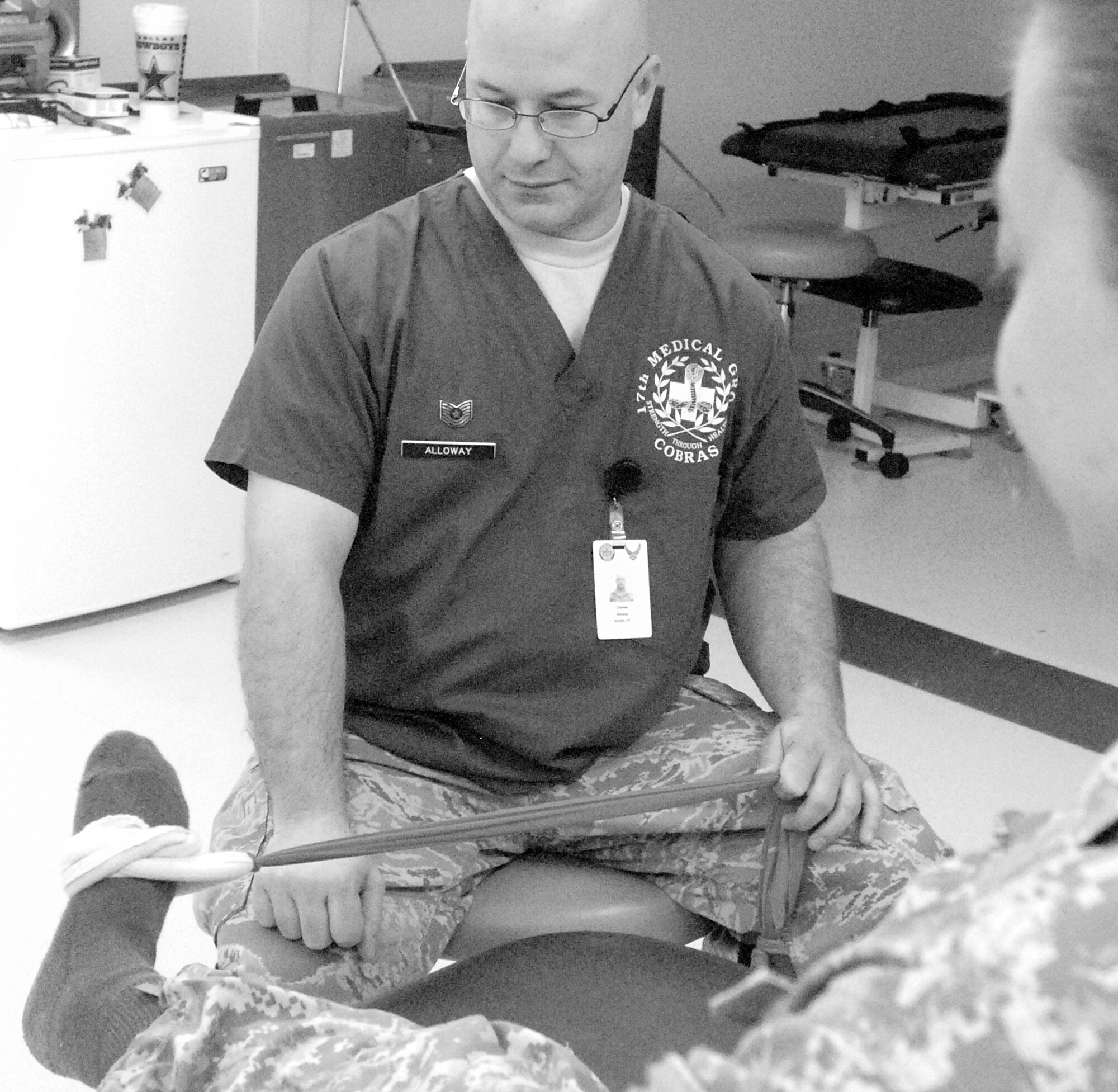 GOODFELLOW AIR FORCE BASE, Texas -- Tech. Sgt. Charles Alloway, 17th Medical Group Physical Therapy NCOIC, stretches a patient's ankle to help the patient recover from a severe ankle sprain. (U.S. Air Force photo/Connie Hempel)