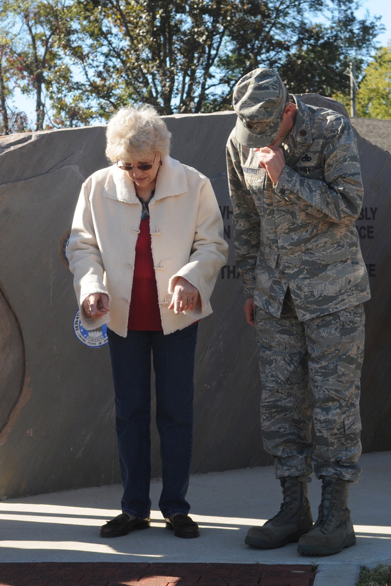 Jean Crabtree and her son Maj. Warren Crabtree, 917th Maintenance Operations Squadron commander, look for his name on a brick at the Fouke, Ark. Veterans Park Memorial, Nov. 6, 2010. The park was dedicated on the same day after several years of fundraising and hard work put in by the local community. The city raised approximately $120,000 for the park. (U.S. Air Force/MSgt Greg Steele)