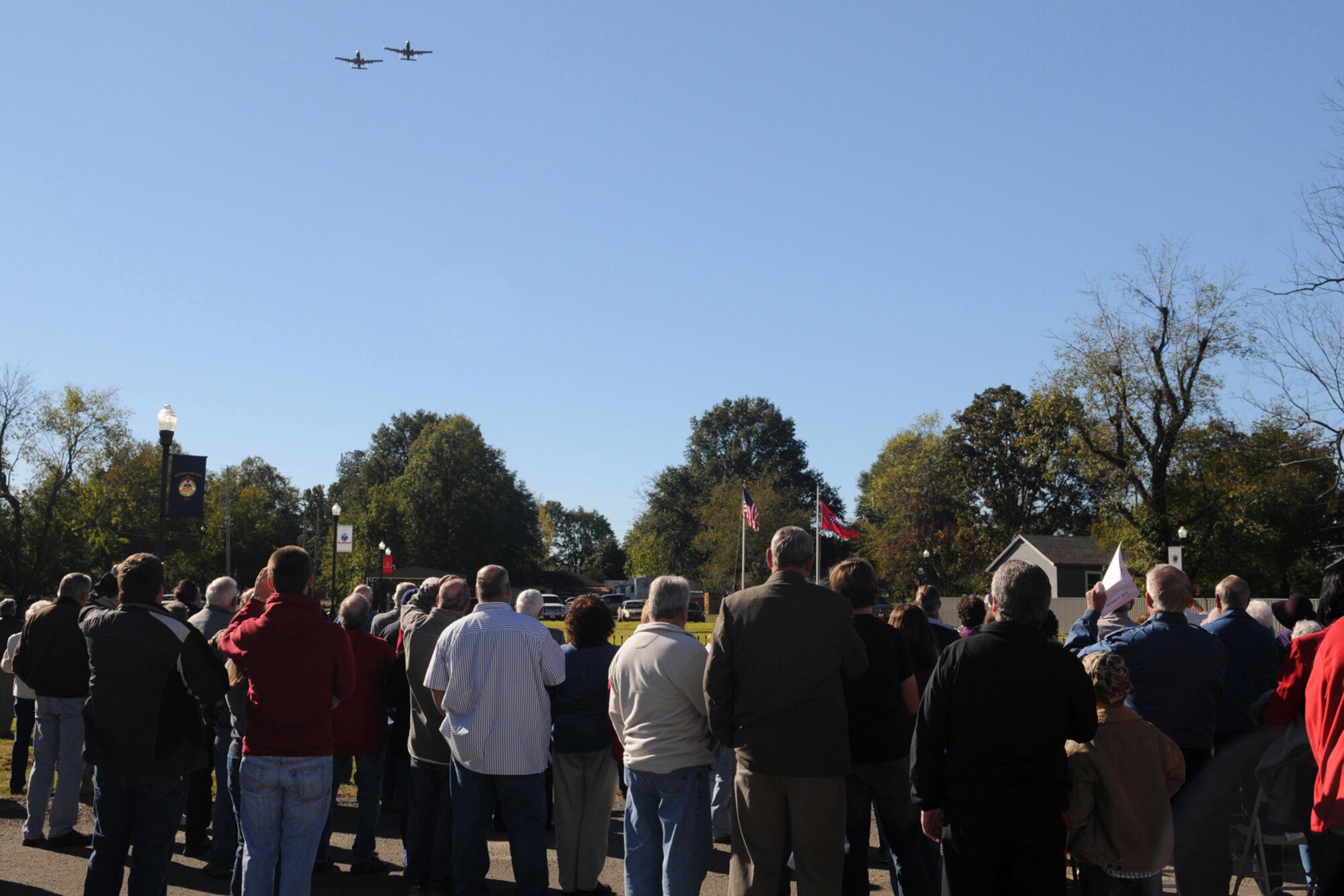 Families of the Fouke, Ark community observe two 917th Wing A-10 Thunderbolt II as they flyover the Fouke, Ark. Veterans Park Dedication, Nov. 6, 2010. The park was dedicated after several years of fundraising and hard work put in by the local community. The city raised approximately $120,000 for the park that will honor past, present and future veterans. (U.S. Air Force/MSgt Greg Steele)

