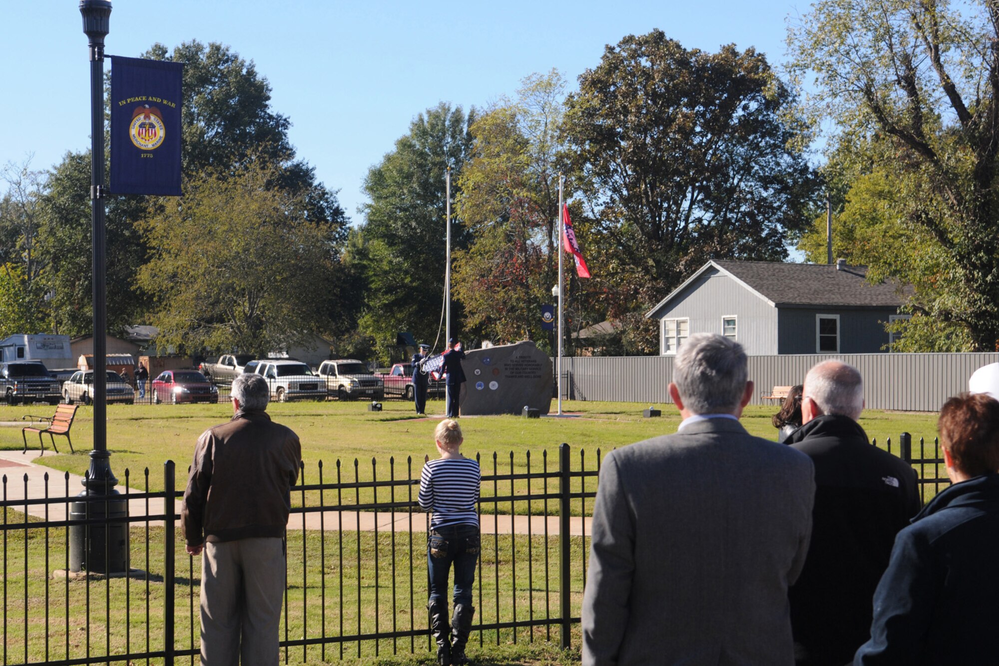 Families of the Fouke, Ark community observe Barksdale AFB, La. Airmen as the raise the American Flag over the Fouke, Ark. Veterans Park Dedication, Nov. 6, 2010. The park was dedicated after several years of fundraising and hard work put in by the local community. The city raised approximately $120,000 for the park that will honor past, present and future veterans. (U.S. Air Force/MSgt Greg Steele)