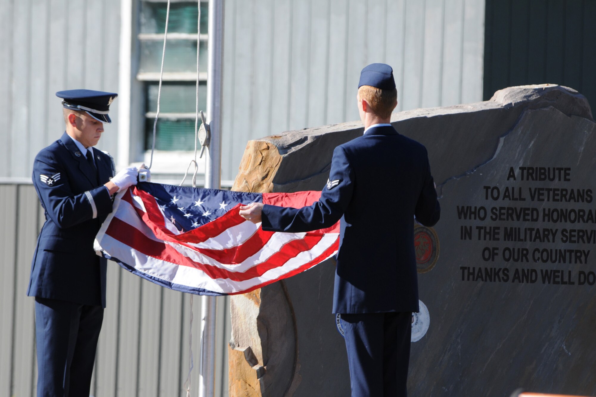Senior Airman Jacob Foster and Airman 1st Class Joshua Fisher of Barksdale AFB, La., raise the American Flag over the Fouke, Ark., Veterans Park Dedication, Nov. 6, 2010. The park was dedicated after several years of fundraising and hard work put in by the local community and businesses. The city raised approximately $120,000 for the park that will honor past, present and future veterans. (U.S. Air Force/MSgt Greg Steele)

