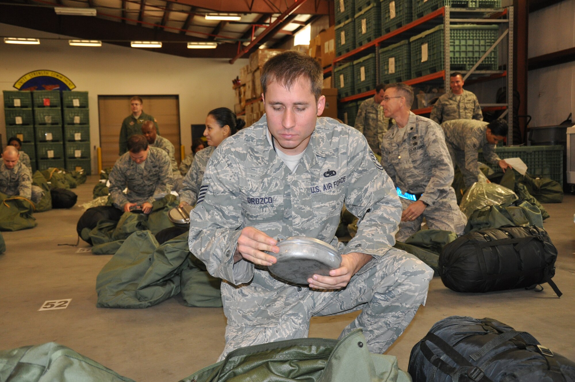 SSgt Anthony Orozco, 315th ALCF, inventories his mobility bag during the MOBEX over November UTA. Support personnel processed members over the two day exercise in preparation for the ORI in November 2011.