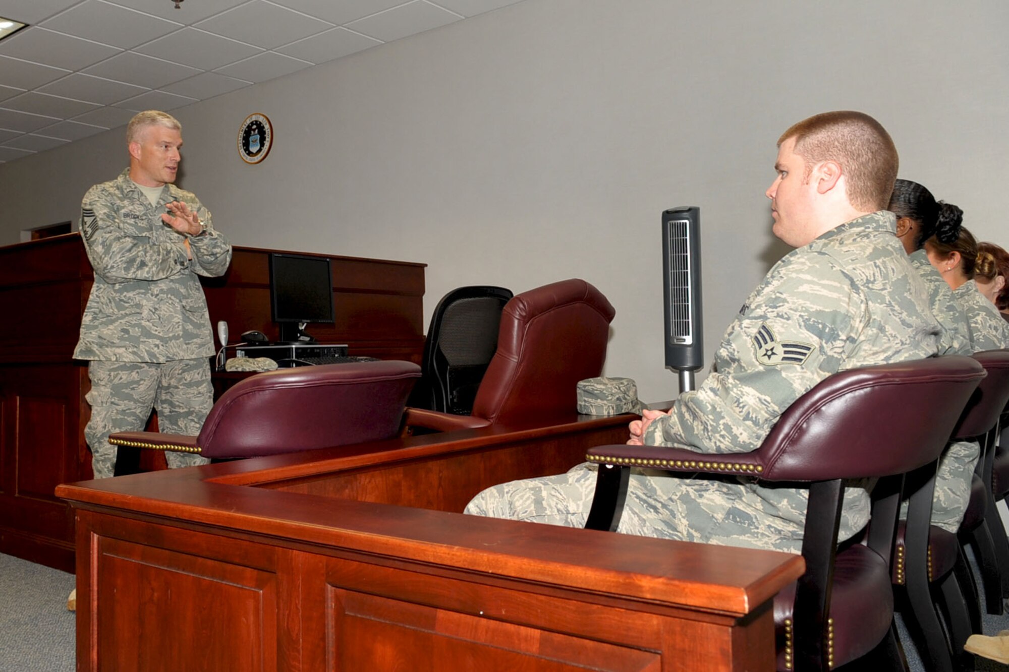 LANGLEY AIR FORCE BASE, Va. -- Chief Master Sgt. Robert Brooks, 9th Air Force command chief, congratulates the legal office on their Ninth Air Force Outstanding Legal Office of the Year award, while visiting the base Oct. 26. The Langley Legal Office was selected from among the four bases in 9 AF and approximately 10 installations in Air Combat Command for the prestigious honors. (U.S. Air Force photo/Staff Sgt. Ashley Hawkins)(RELEASED)