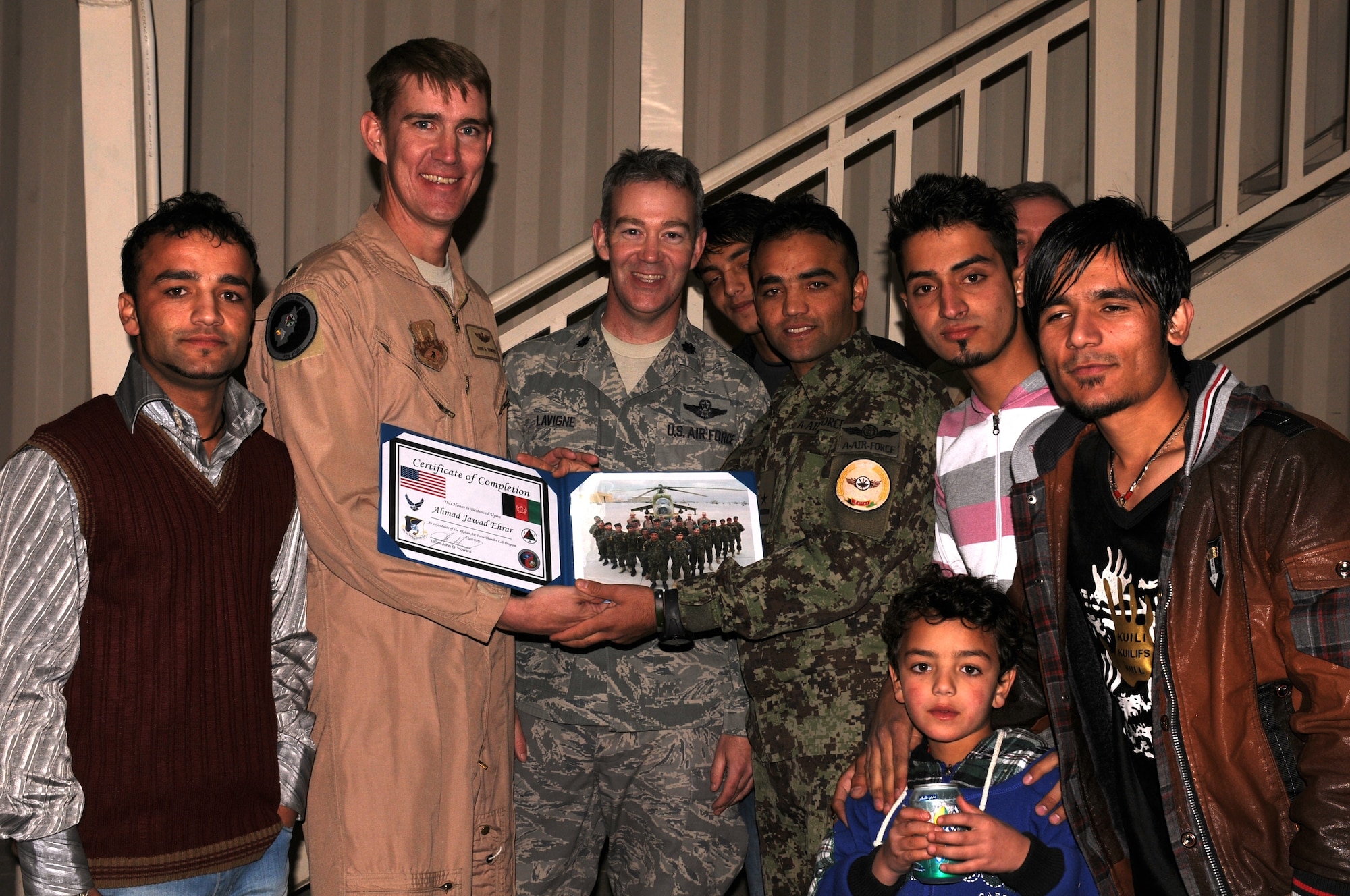KABUL, Afghanistan - Afghan Air Force’s Thunder Lab celebrates the graduation of 14 pilot candidates who will now proceed to more advanced training in the U.S. (U.S. Air Force photo by Capt. Rob Leese/ RELEASED).