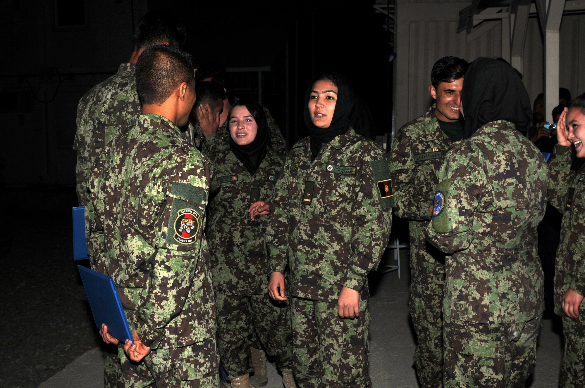 KABUL, Afghanistan - Afghan Air Force’s Thunder Lab celebrates the graduation of 14 pilot candidates who will now proceed to more advanced training in the U.S. (U.S. Air Force photo by Capt. Rob Leese/ RELEASED).