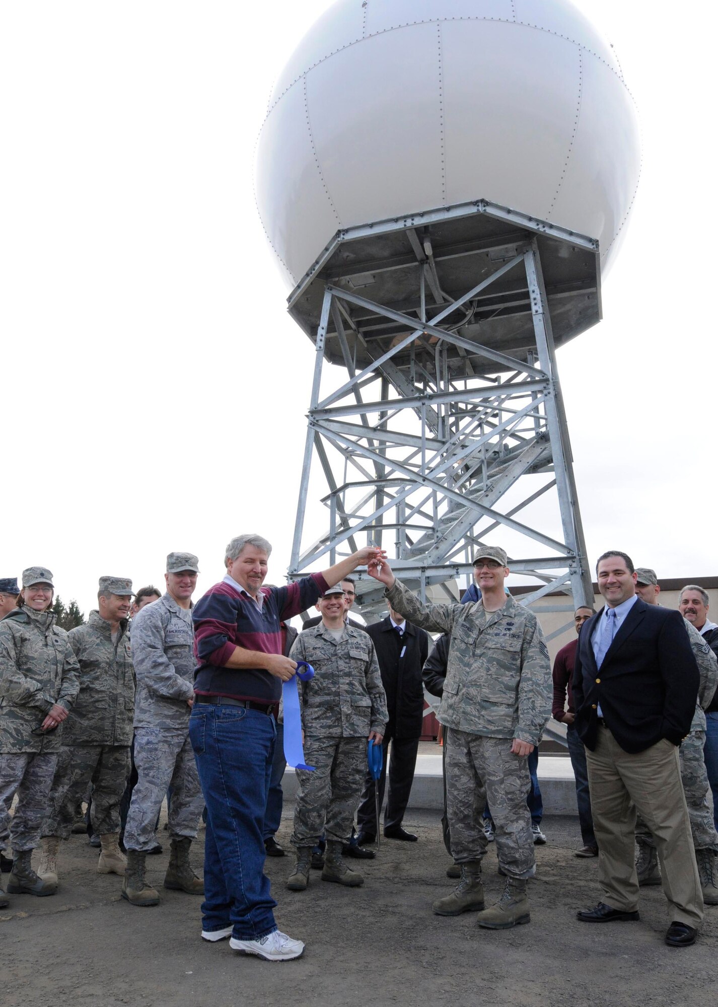 Project managers from the 21st OWS and leaders from U.S. Air Forces in Europe, the 86th Civil Engineer Squadron, 86th Communications Squadron, Lockheed Martin and the U.S. Army Corps of Engineers take part in a  ribbon cutting for the new MARK IVB Meteorological Data System at Kapaun Air Station, Nov. 5. As one of the last Air Force assets left on Sembach, 21st OWS leaders are working hard to ensure the scheduled 2011 move to Kapaun Air Station, Germany is completed as efficiently as possible. (U.S. Air Force photo by Airman Kendra Alba)