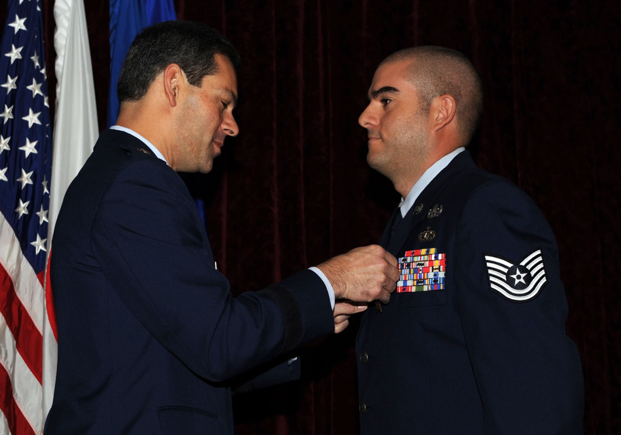 Brig. Gen. Ken Wilsbach presents the Bronze Star medal to Tech. Sgt. Lazaro Acosta, 18th Civil Engineering Squadron, during a ceremony Nov. 5, at the Rocker NCO club.  Tech. Sgt. Acosta distinguished himself through exceptionally meritorious service in support of Operation Iraqi Freedom, Feb. 16 - Aug. 12, 2010. (U.S. Air Force photo/ Junko Kinjo)