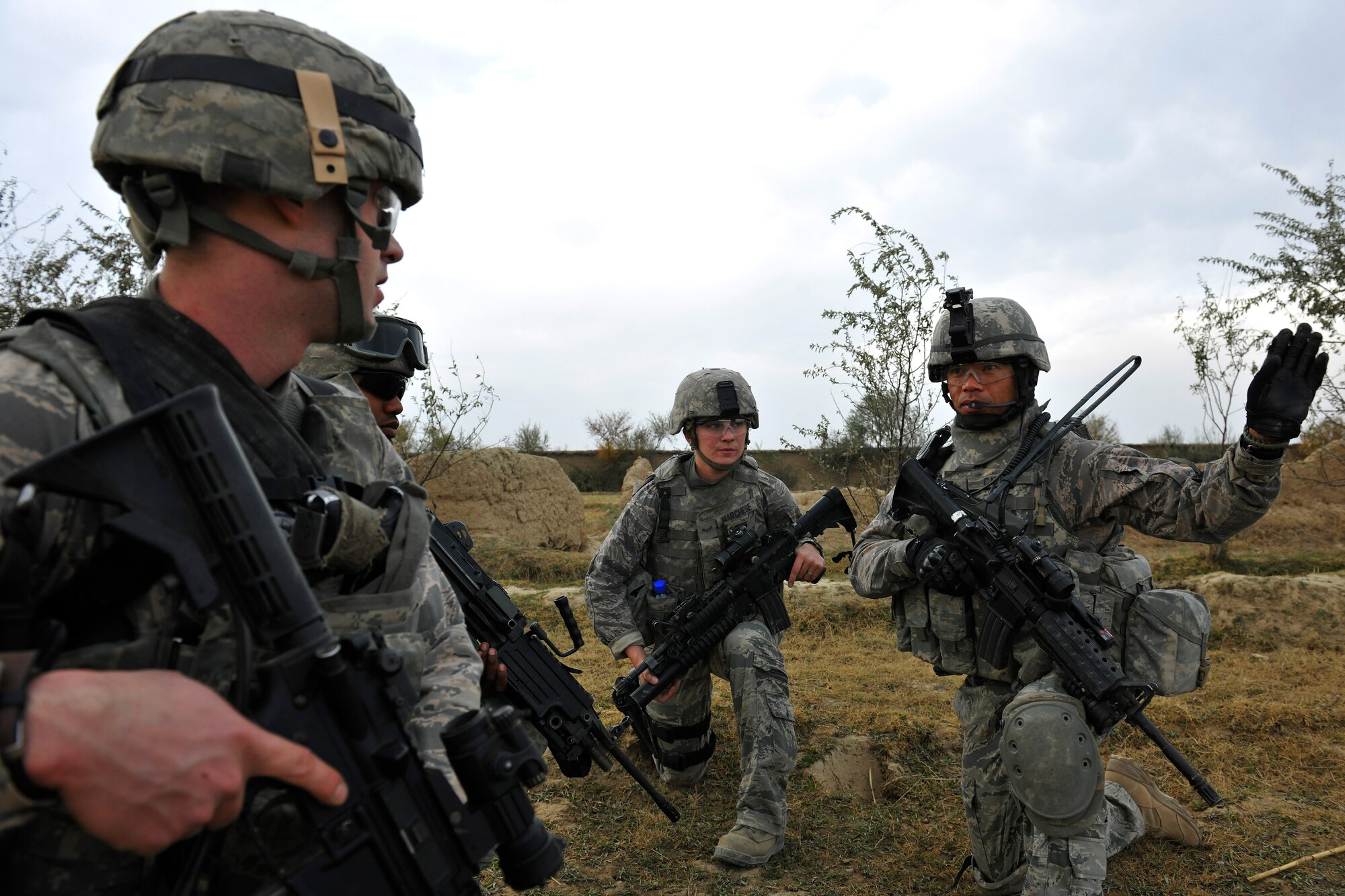 Master Sgt. Enrico Catubo, a flight sergeant assigned to the 455th Expeditionary Security Forces, gives directions to his squad during a dismounted patrol near Bagram Airfield, Afghanistan, November 5, 2010. The Airmen were conducting presence patrols and visiting with Afghans. (U.S. Air Force photo/Staff Sgt. Christopher Boitz)