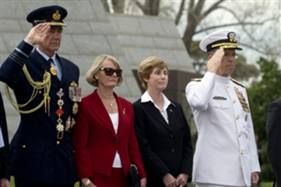 Chairman of the Joint Chiefs of Staff Adm. Mike Mullen salutes during a wreath laying ceremony at the Shrine of Remembrance in Melbourne, Australia, on Nov. 7, 2010.  Secretary of Defense Robert M. Gates and Secretary of State Hillary Clinton also attended.  