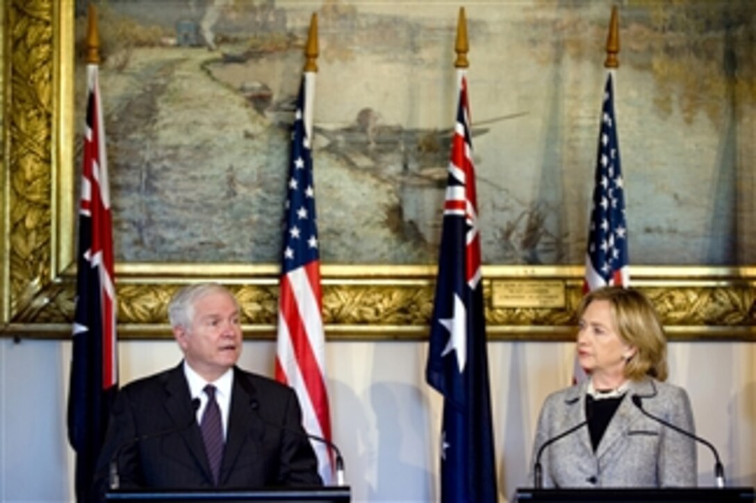 Secretary of Defense Robert M. Gates responds to a question while Secretary of State Hillary Rodham Clinton looks on during a joint press conference with Australian Minister for Defense Stephen Smith and Australian Minister for Foreign Affairs Kevin Rudd after the annual Australia-U.S. Ministerial Consultations in Melbourne, Australia, on Nov. 8, 2010.  