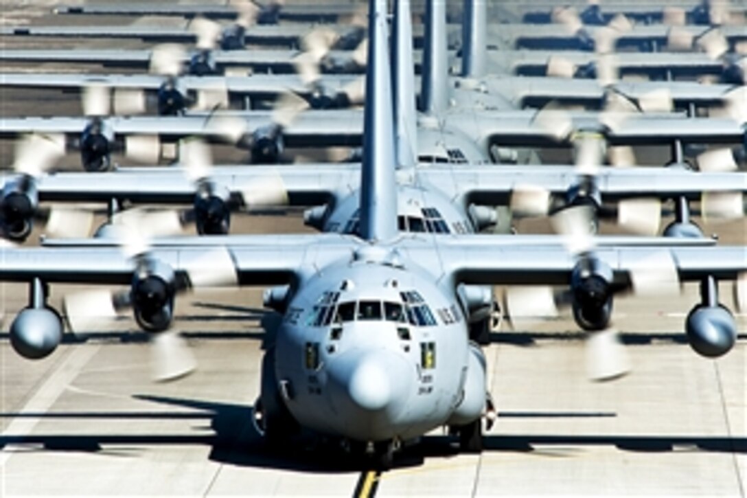 U.S. Air Force C-130 Hercules aircraft taxi out for a mission during a seven-ship sortie on Yokota Air Base, Japan, Nov. 4, 2010. The C-130 crews are assigned to the 36th Airlift Squadron, which provides C-130 aircrews to conduct theater airlift, special operations, aeromedical evacuation, search and rescue, repatriation and humanitarian relief missions.