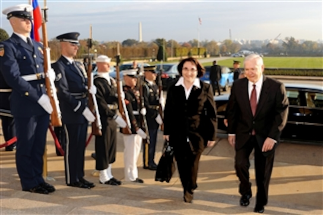Secretary of Defense Robert M. Gates escorts Slovenian Defense Minister Ljubica Jelusic through an honor and into the Pentagon on Nov. 5, 2010.  Gates and Jelusic will hold bilateral security talks on a broad range of topics.  