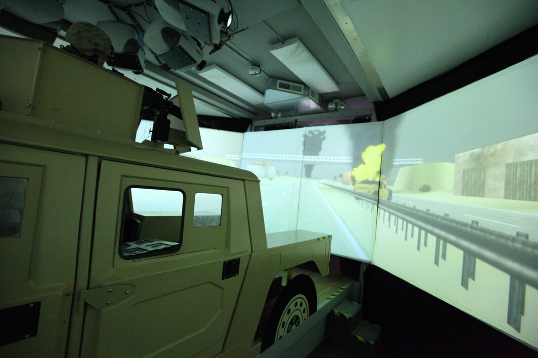 Marines with Black Sea Rotational Force, 4th Marine Logistics Group, engage computer simulated enemy vehicles while utilizing the Virtual Combat Convoy Trainer Nov. 8.