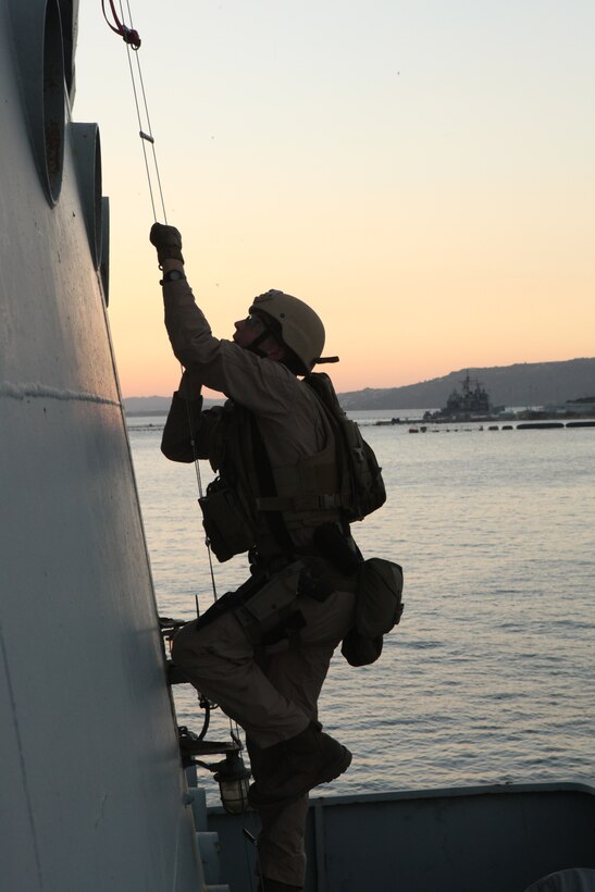 Corporal Larry Williamson, a member of 26th Marine Expeditionary Unit?s Maritime Interception Operations (MIO) assault force, climbs a caving ladder aboard HNS Aris at Souda Bay, Crete, Greece, Nov. 9, 2010. The MIO assault force went through a one-week course at the NATO Maritime Interception Operations Training Center in tactics to board a suspect vessel.