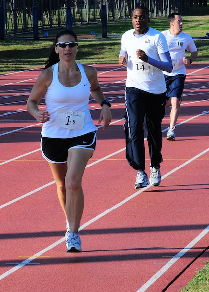YOKOTA AIR BASE, Japan -- YOKOTA AIR BASE, Japan -- Viking Run participants run around a track as part of a 12-hour relay to raise money for the Combined Federal Campaign here, Nov. 6. Every year, each branch of the service raises money for more than 2300 charities through the CFC. (U.S. Air Force photo/Airman First Class Lynsie Nichols) 