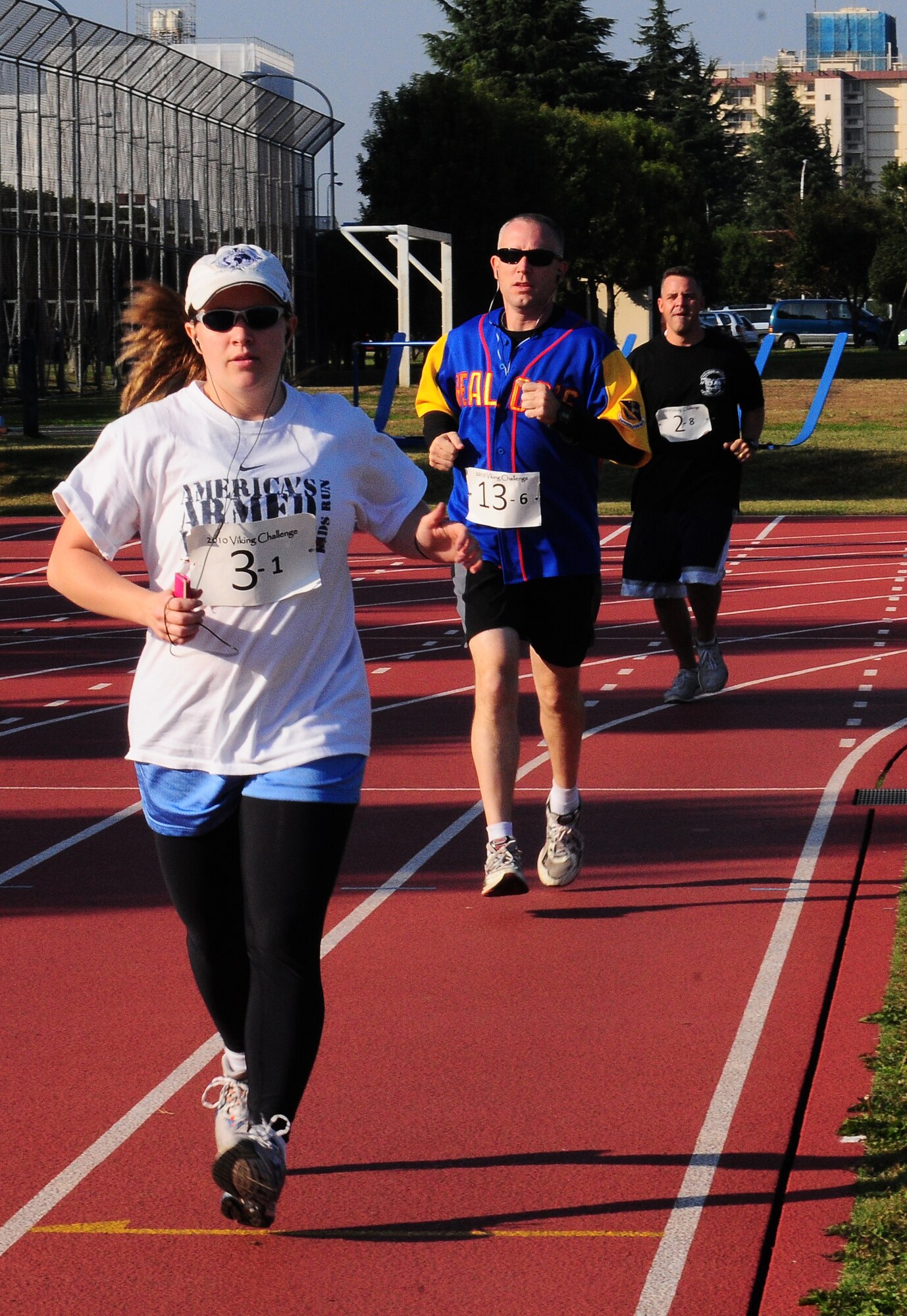 YOKOTA AIR BASE, Japan -- YOKOTA AIR BASE, Japan -- Viking Run participants run around a track as part of a 12-hour relay to raise money for the Combined Federal Campaign here, Nov. 6. Every year, each branch of the service raises money for more than 2300 charities through the CFC. (U.S. Air Force photo/Airman First Class Lynsie Nichols) 