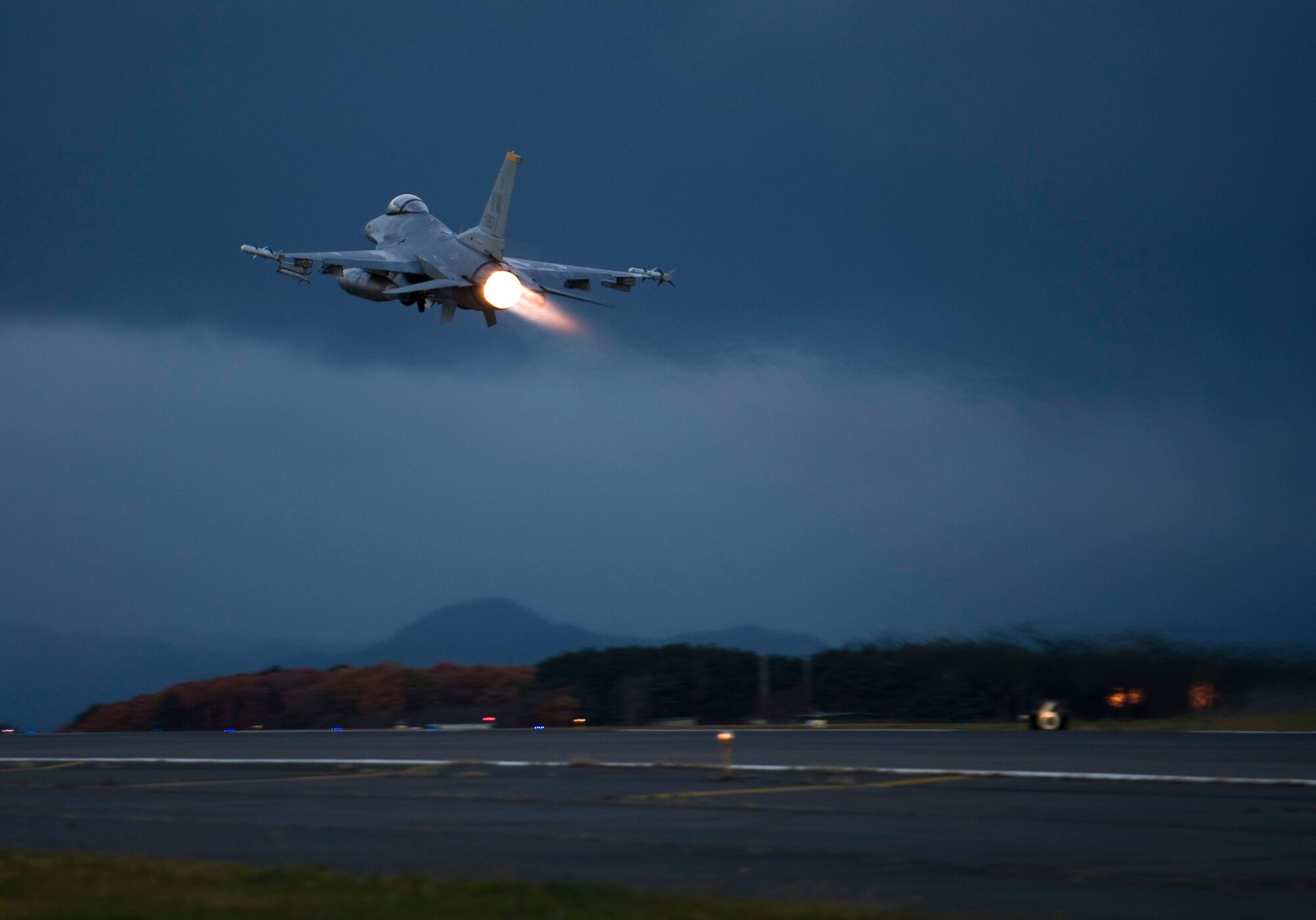An F-16 Fighting Falcon takes off at Misawa Air Base, Japan, on the final day of an operational readiness exercise, Nov. 10, 2010. Pilots use the F-16's afterburner, delivering approximately 27,000 pounds of thrust, to rotate skyward as quickly as possible. (U.S. Air Force photo by Staff Sgt. Samuel Morse/Released)