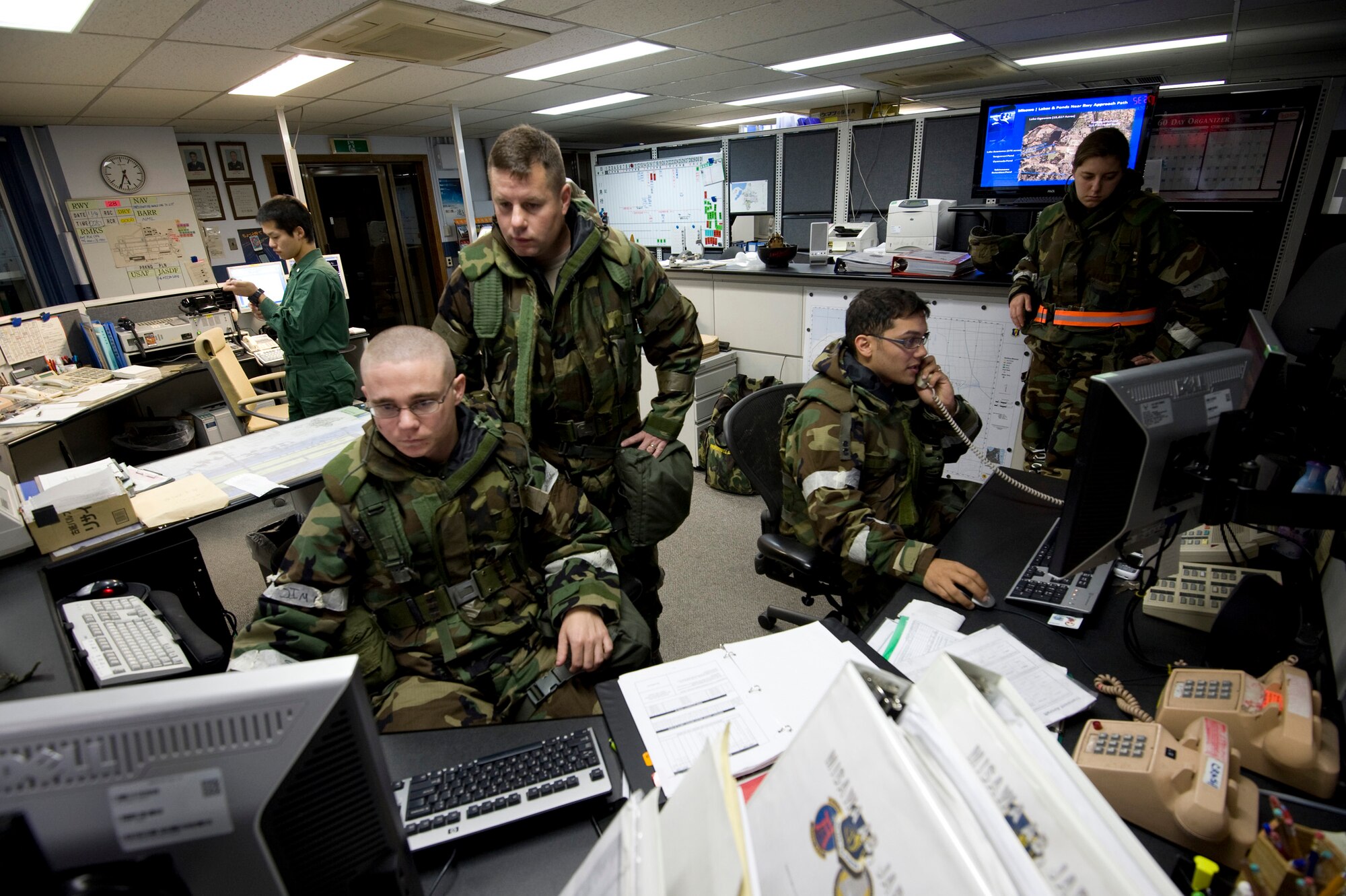 Airmen from the 35th Operations Support Squadron airfield management flight monitor flightline operations on the final day of an operational readiness exercise at Misawa Air Base, Japan, Nov. 10, 2010. Airfield management is one of the only units at Misawa that works directly with their Japan Air Self-Defense Force counterparts. (U.S. Air Force photo by Staff Sgt. Samuel Morse/Released)