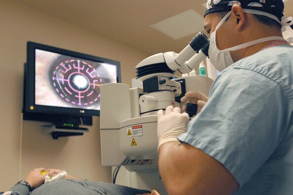 Lt. Col. (Dr.) Charles Reilly performs refractive surgery at the Joint Warfighter Refractive Surgery Center Nov. 3, 2010, at Lackland Air Force Base, Texas. Dr. Reilly recently performed a unique procedure to restore a patient's vision using a type of glue to correct a thinning cornea. Dr. Reilly is an ophthalmologist with the 59th Surgical Support Squadron. (U.S. Air Force photo/Staff Sgt. Robert Barnett)