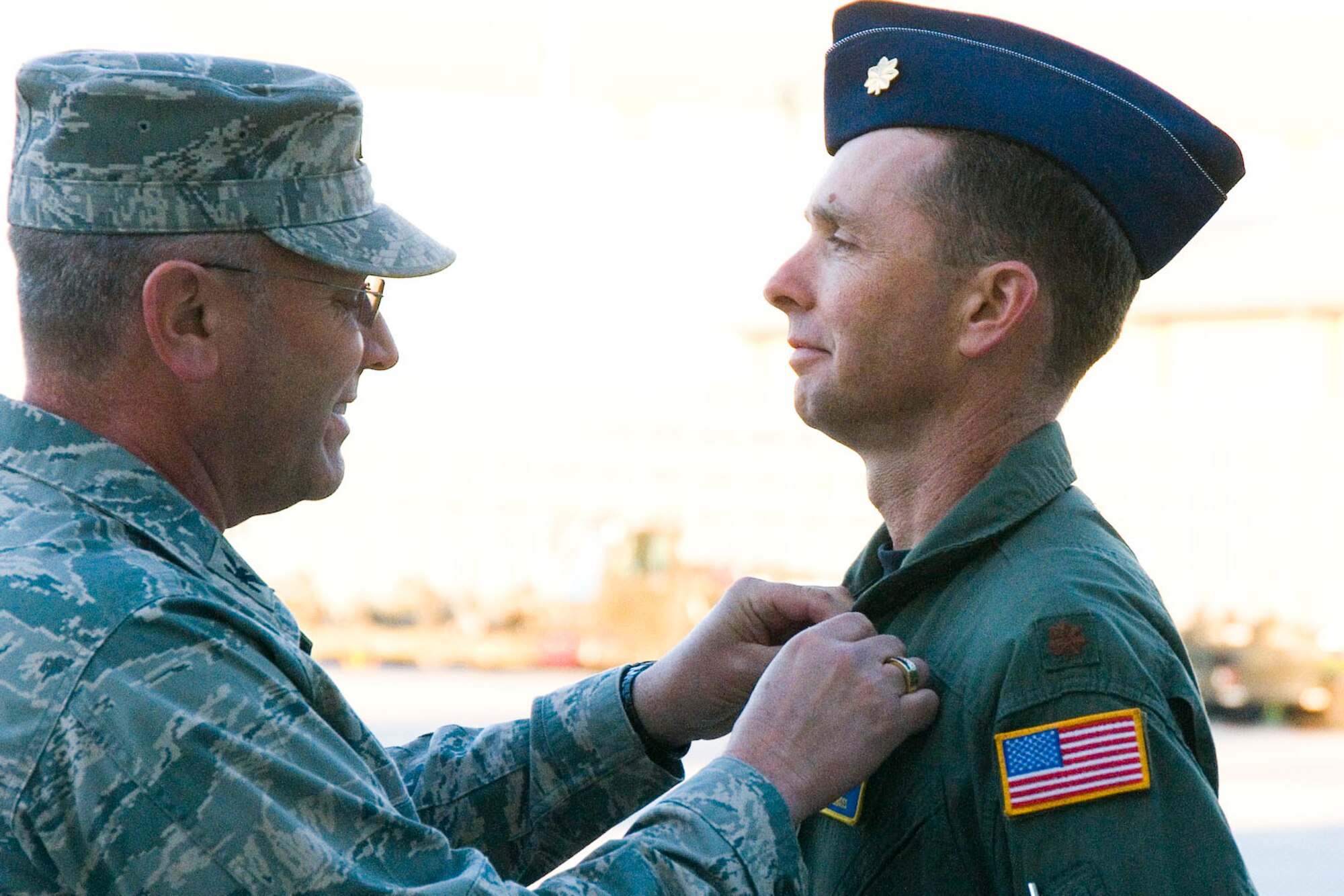 Col Roger Nye, 167th Airlift Wing commander, pins a Bronze Star Medal on Major Peter Gross during a commanders call at the unit on October 3, 2010. Gross was awarded the Bronze Star for his yearlong deployment as a senior command and control advisor to the Afghan National Army Air Corps. (U.S. Air Force photo by MSgt Emily Beightol-Deyerle)