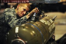 MINOT AIR FORCE BASE, N.D. -- Staff Sgt. Shane Jones, 5th Aircraft Maintenance Squadron weapons loader, inspects a CBU – 103 Cluster Bomb that will be loaded to a B-52H Stratofortress for a load competition here Oct. 29. Load competitions are used to build unit morale and cohesiveness, as well as a chance for weapons loaders to show off their skills to their peers and leadership. (U.S. Air Force photo/Airman 1st Class Aaron-Forrest Wainwright) 