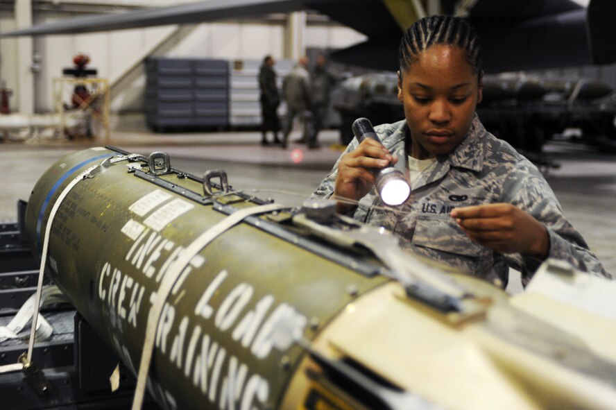 MINOT AIR FORCE BASE, N.D. -- Senior Airman Shantel Lett, 5th Aircraft Maintenance Squadron weapons loader, inspects a CBU – 103 Cluster Bomb that will be loaded to a B-52H Stratofortress for a load competition here Oct. 29. Load competitions are used to build unit morale and cohesiveness, as well as a chance for weapons loaders to show off their skills to their peers and leadership. (U.S. Air Force photo/Airman 1st Class Aaron-Forrest Wainwright)