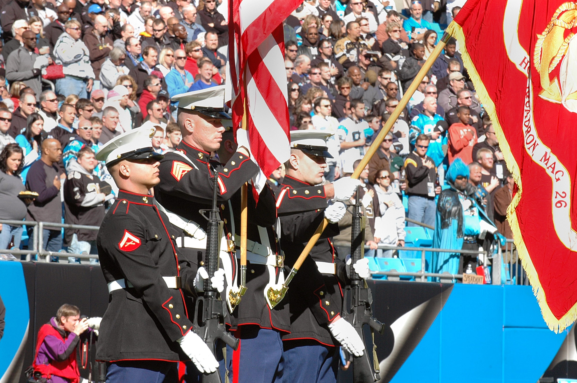 Members of the Marine Corps post the colors during the Carolina Panthers and New Orleans Saints pre-game ceremony Nov. 7, 2010, in Charlotte, N.C. The Carolina Panthers hosted color guard members from all branches of the military in recognition of Veterans Day. The Marine Corps color guard team is assigned to Marine Corps Air Station New River, Jacksonville, Fla. (U.S. Air Force photo/Staff Sgt. Marie Brown)