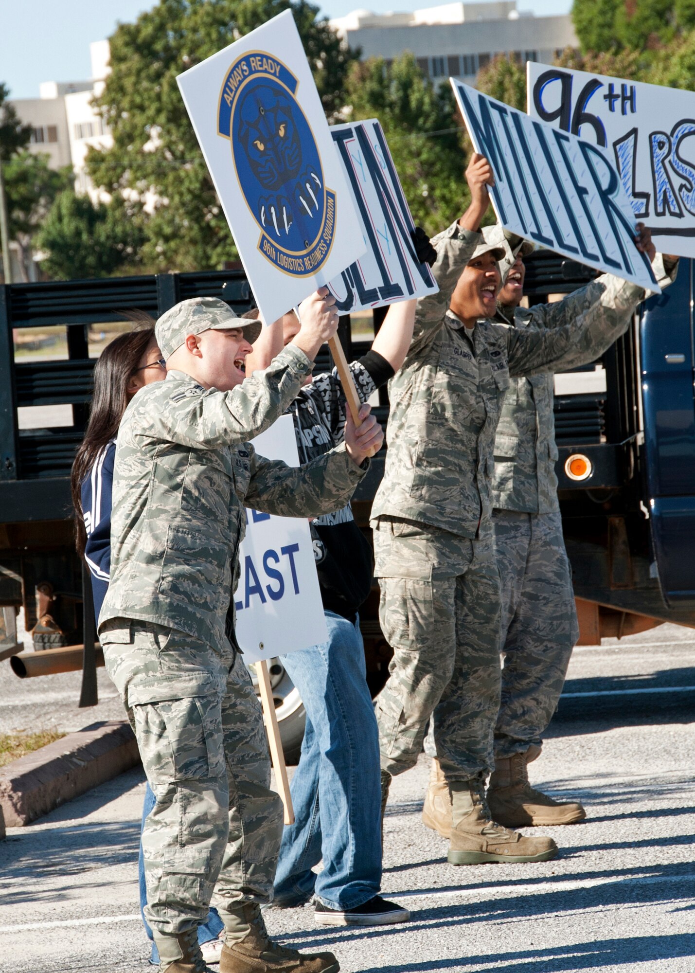 Cheerleaders for the 96th Logistics Readiness Squadron encourage their team during the first-ever Eglin/Hurlburt Field LRS competition Nov. 5.  Hurlburt’s “Team A” won the overall competition almost five minutes.  The “best-time” competition included pallet building, obstacle courses and tire changing.  (U.S. Air Force photo/ Samuel King Jr.)