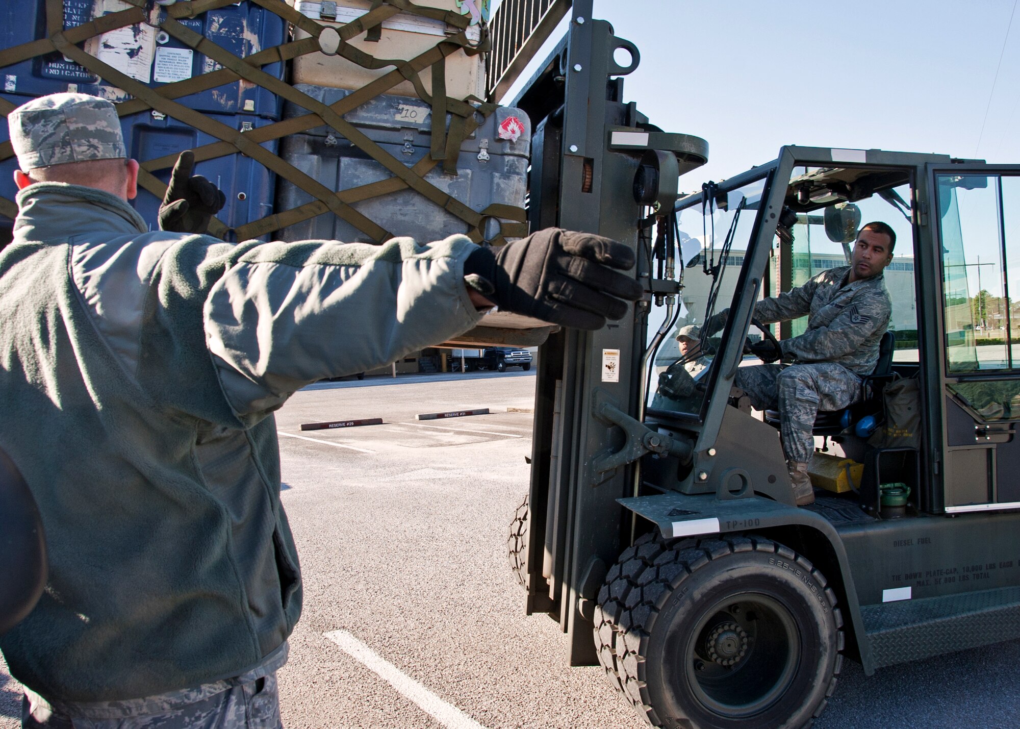 Staff Sgt. Niles Coleman, 1st Special Operations Logistics Readiness Squadron, moves his forklift toward the truck bed during the timed pallet loading portion at the first-ever Eglin/Hurlburt Field LRS competition Nov. 5.  Hurlburt’s “Team A” won the overall competition almost five minutes.  The “best-time” competition included pallet building, obstacle courses and tire changing.  (U.S. Air Force photo/ Samuel King Jr.)