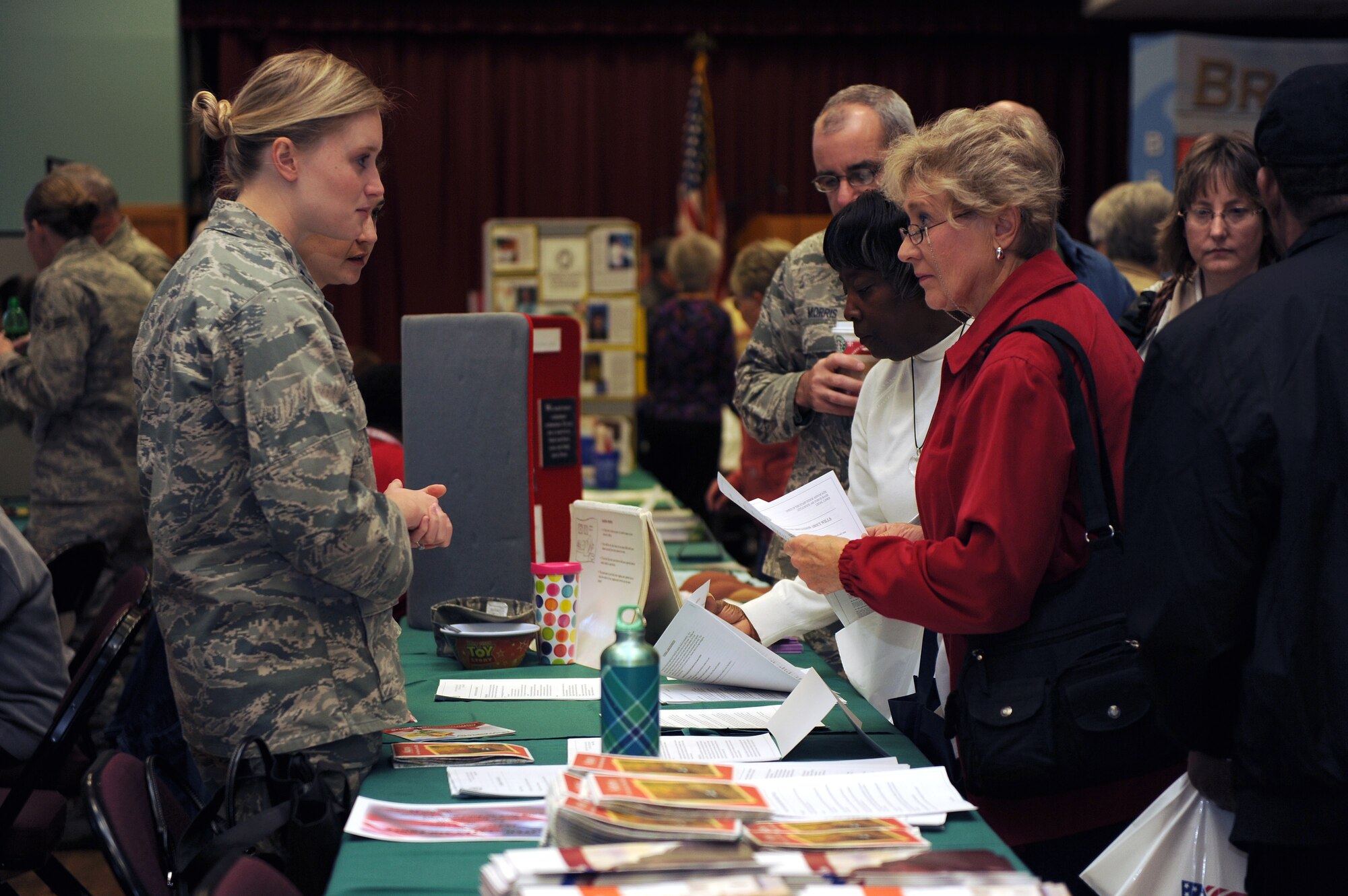 Members from the 19th Airlift Wing legal office go over proper documentation for veterans during Military Retiree Appreciation Day Nov. 6 at the Thomas Community Activities Center.  The day is a chance for Team Little Rock members to offer a variety of services to retirees in a one-stop shop.  (U.S. Air Force photo by Airman 1st Class Ellora Stewart)