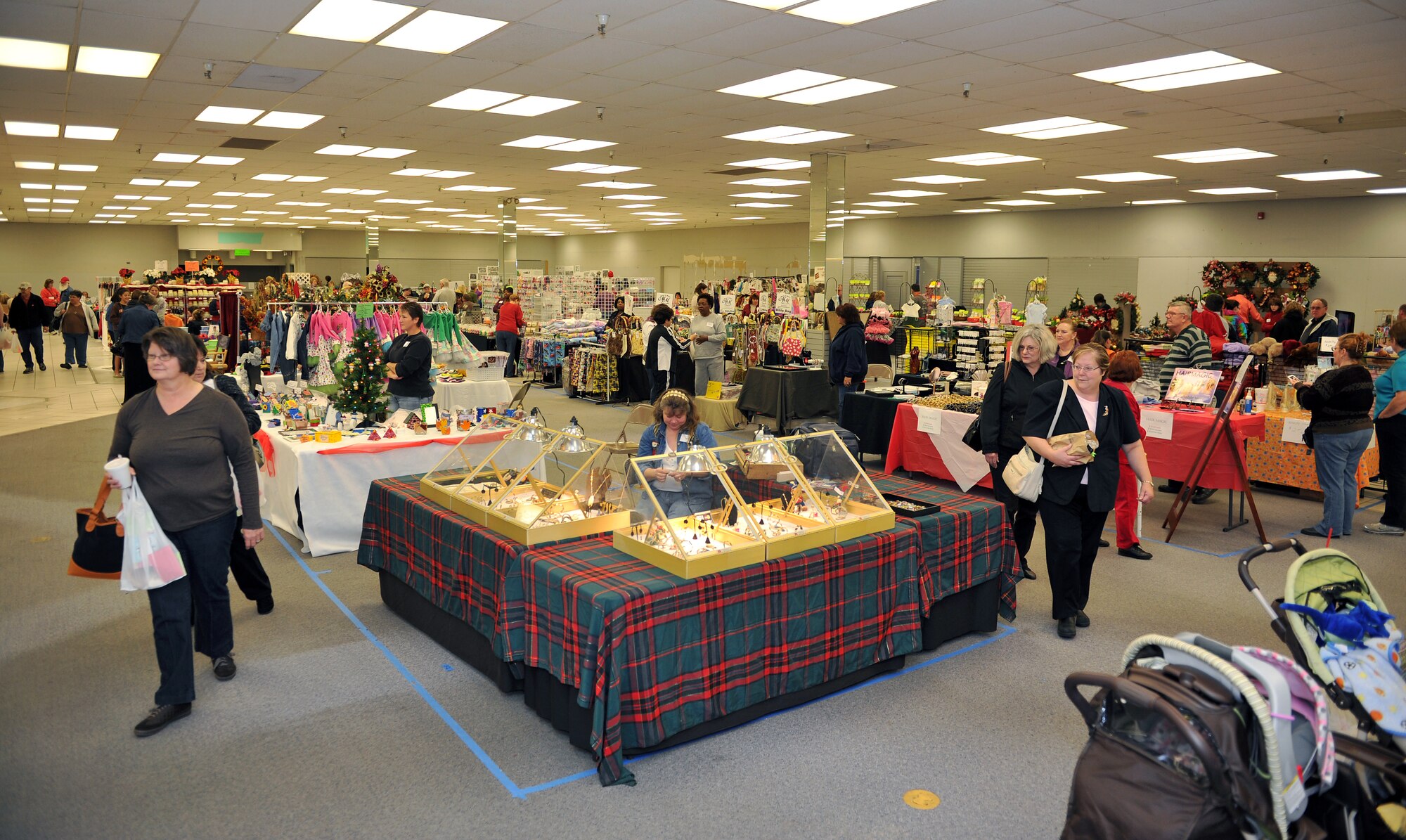 Team Little Rock members shop for crafts and deals Nov. 5 at the Spouses Club Holiday Bazaar. Many local vendors participated in the bazaar located at the old base exchange (U.S. Air Force photo by Staff Sgt. Chris Willis)