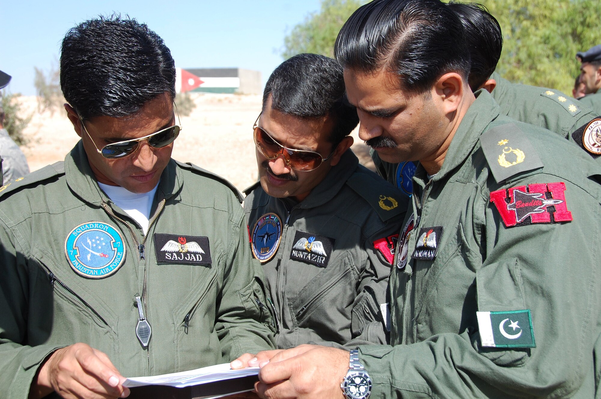 Pakistani contingent members discuss flight plans Nov. 2, 2010, after wrapping up Falcon Air Meet 2010 ceremonies in Azraq, Jordan. The air forces of Pakistan, Jordan, the U.S. and United Arab Emirates competed in the annual two week event in Jordan hosted by the Royal Jordanian Air Force. The overall winners of the competition were the members of the Royal Jordanian Air Force team. (U.S. Air Force photo/Alan Black)