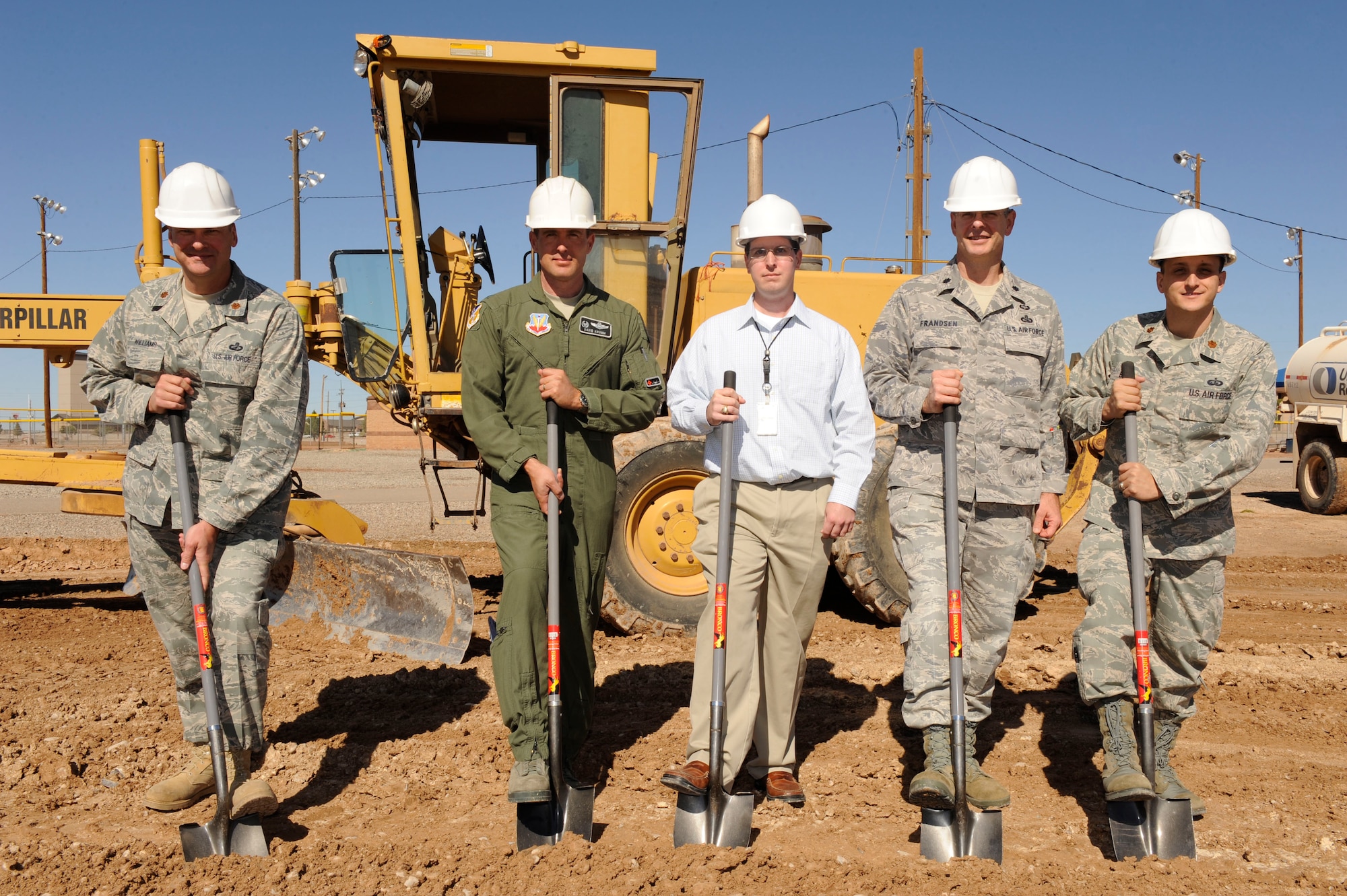 HOLLOMAN AIR FORCE BASE, N.M. -- (From left to right) Major Sean Williams, 49th Contracting Squadron, Col. David Krumm, 49th Wing commander, Robert Byard and Lt. Col. Matthew Frandsen both from the 49th Civil Engineer Squadron and Major Christopher Busque, 49th Force Support Squadron, turn the first sod for the ceremonial Groundbreaking  at the new Fitness Pavillion construction site Nov. 2, 2010. Along with the Fitness Pavillion, additional projects are being added to the Domenici Fitness Center's outdoor fitness complex including rennovations to the tennis courts and softball fields. (U.S. Air Force photo by Airman 1st Class Eileen Payne/Released)