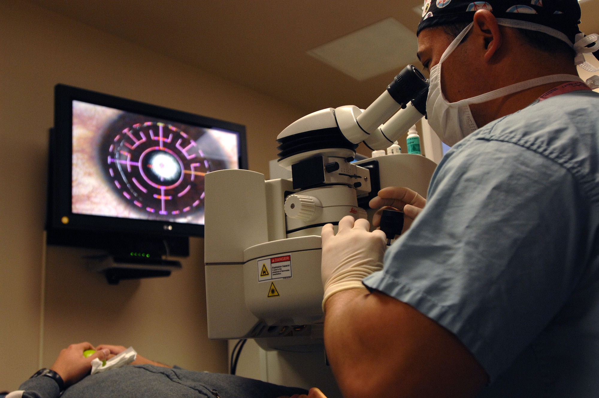 Lt. Col. (Dr.) Charles Reilly, ophthalmologist, 59th Surgical Support Squadron, performs refractive surgery at the Joint Warfighter Refractive Surgery Center, Lackland Air Force Base, Texas, on Nov. 3, 2010. Dr. Reilly recently performed a very unique procedure to restore a patient?s vision using a type of glue to correct a thinning cornea. (U.S. Air Force photo by Staff Sgt. Robert Barnett)