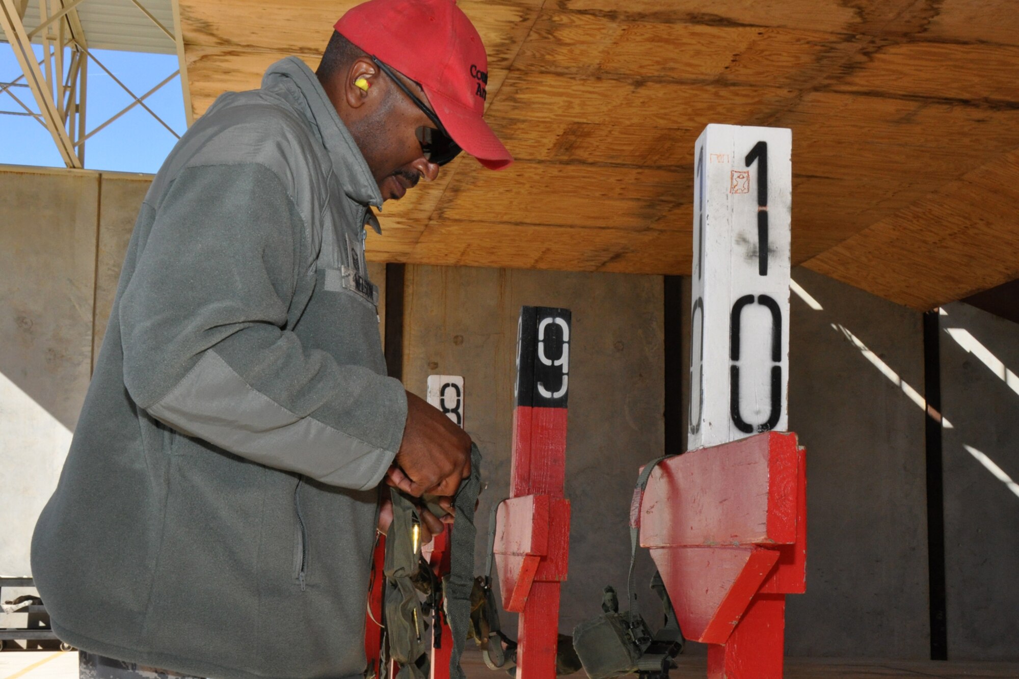 Master Sgt. B.K. Nelson, non-commissioned officer-in-charge, 917th Security Forces Squadron Combat Arms, prepares weapons for Airmen from the 917th Civil Engineer Squadron who are qualifying with the M4, 5.56mm, Carbine on the firing range at Barksdale Air Force Base, La., Nov 5, 2010. The 917 CES Airmen are completing the annual weapons training to keep current in their war fighting skills. The training is necessary to keep the unit ready to deploy with little or no notice in defense of the United States and its interests. (U.S. Air Force photo/Tech. Sgt. Jeff Walston)   
