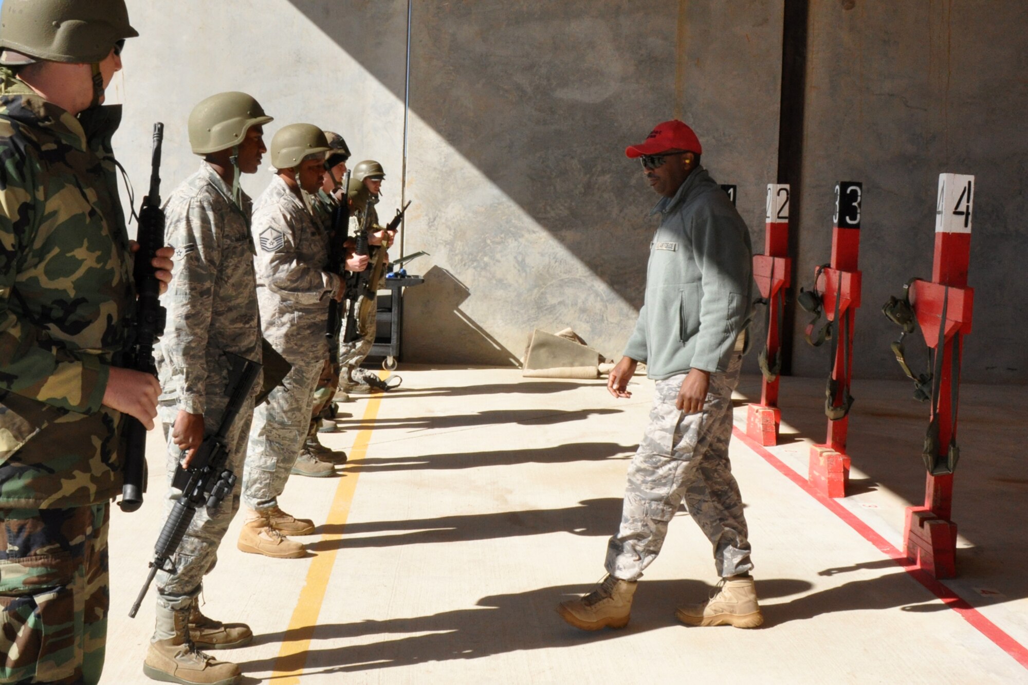 Master Sgt. B.K. Nelson, non-commissioned officer-in-charge, 917th Security Forces Squadron Combat Arms, instructs Airmen from the 917th Civil Engineer Squadron in the proper handling of weapons at the firing range on Barksdale Air Force Base, La., Nov 5, 2010. The 917 CES Airmen are completing the annual weapons training to keep current in their war fighting skills. The training is necessary to keep the unit ready to deploy with little or no notice in defense of the United States and its interests. (U.S. Air Force photo/Tech. Sgt. Jeff Walston)   
