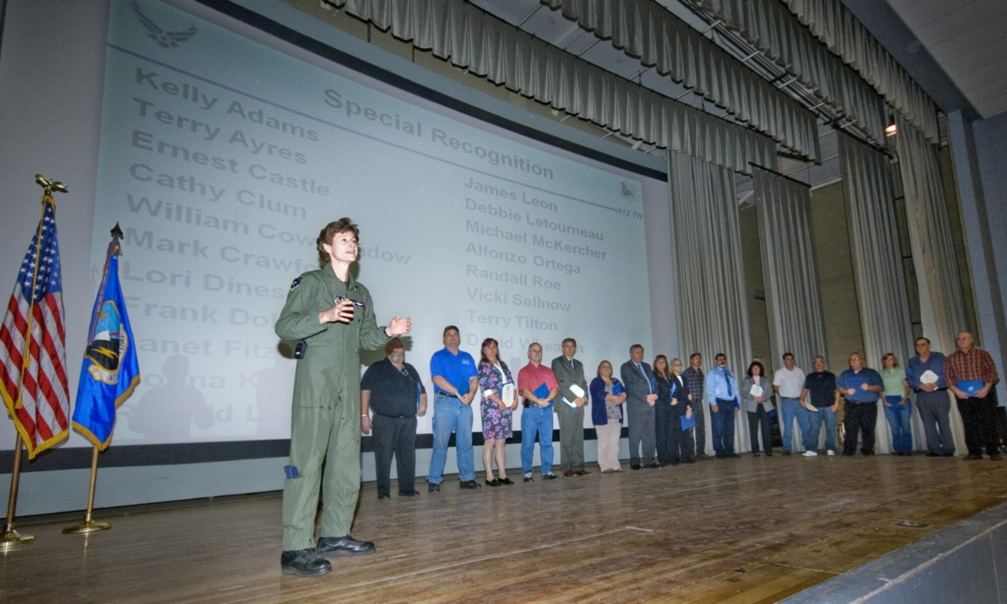 Col. Dawn M. Dunlop, 412th Test Wing commander, addresses a packed Base Theater, Nov. 4, during the wing’s 3rd quarter awards ceremony. Along with the quarterly awards, the wing handed out dozens of additional awards including major command and 30-year service awards (pictured). (Air Force photo by Rob Densmore)