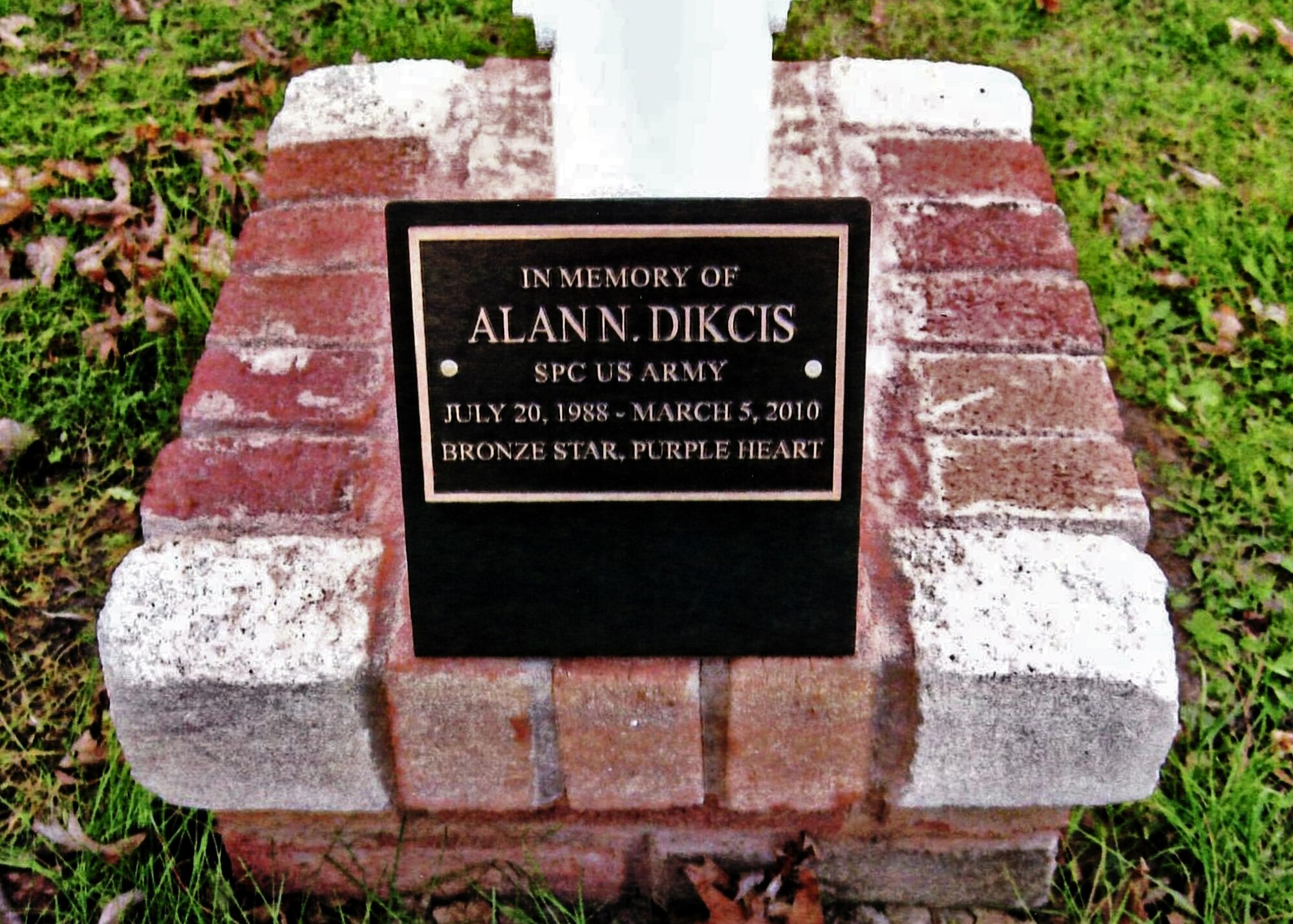 The flagpole flag and plaque volunteers donated and installed, November 9, 2010, Wheatfield NY. Friends from the 914th and 107th Airlift Wing’s along with Cub Scout Pack 833 out of Adams Fire Hall in Wheatfield, helped in establishing a memorial flag pole and plaque in honor of Army Spc. Alan Dikcis. (Courtesy photo)