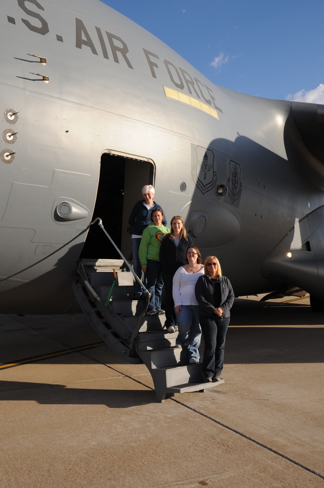 ALTUS AIR FORCE BASE, Okla. -- Air Force spouses Trisha Castle, Sara Birnbaum, Mandi Foster, Becky Sparks and Heather Vanderzel take a group photo before their four-hour Spouse Orientation Flight on Oct 27, 2010 (U.S. Air Force photo by Airman 1st Class Christopher Toon 97th Air Mobility Wing Public Affairs)