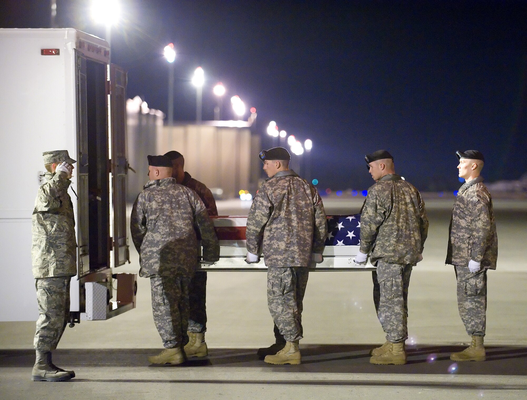 A U.S. Army carry team transfers the remains of Army Sgt. Michael F. Paranzino of Middletown, R.I., at Dover Air Force Base, Del., Nov. 6, 2010.  He was assigned to the 1st Battalion, 87th Infantry Regiment, 1st Brigade Combat Team, 10th Mountain Division, Fort Drum, N.Y. (U.S. Air Force photo/Jason Minto)