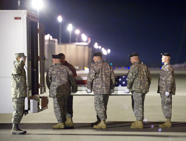 A U.S. Army carry team transfers the remains of Army Sgt. Michael F. Paranzino of Middletown, R.I., at Dover Air Force Base, Del., Nov. 6, 2010.  He was assigned to the 1st Battalion, 87th Infantry Regiment, 1st Brigade Combat Team, 10th Mountain Division, Fort Drum, N.Y. (U.S. Air Force photo/Jason Minto)