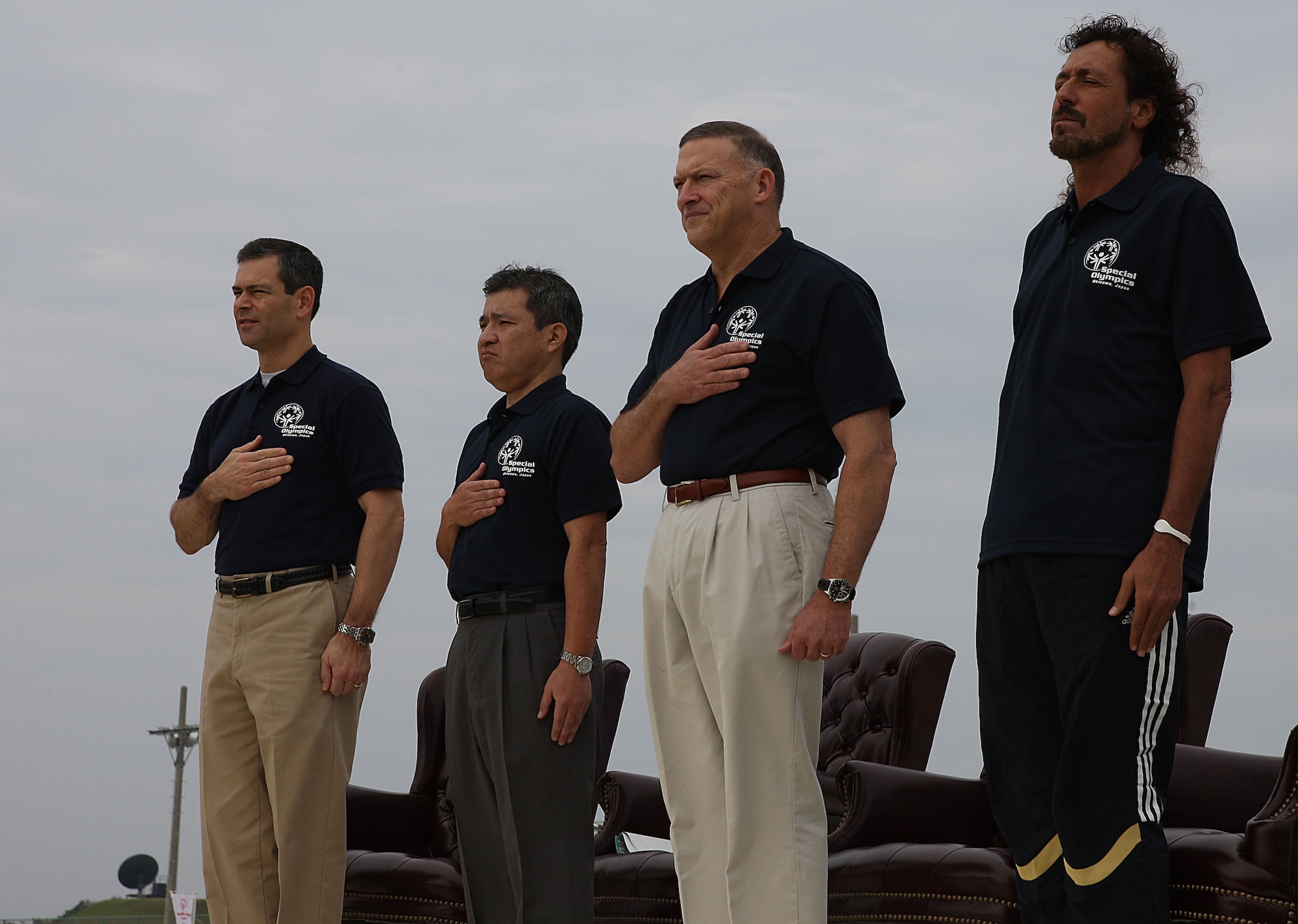 (From left to right) Brig. Gen. Ken Wilsbach, 18th Wing commander, Dir. Gen. Susumu Matayoshi from the Okinawa Prefectural Government, Gen. Gary North, Pacific Air Forces commander and Rui Ramos, a former team Japan FIFA soccer star and beach soccer coach stand onstage during the opening ceremonies of the Kadena Special Olympics Nov. 6. (Courtesy photo by Chip Steitz)